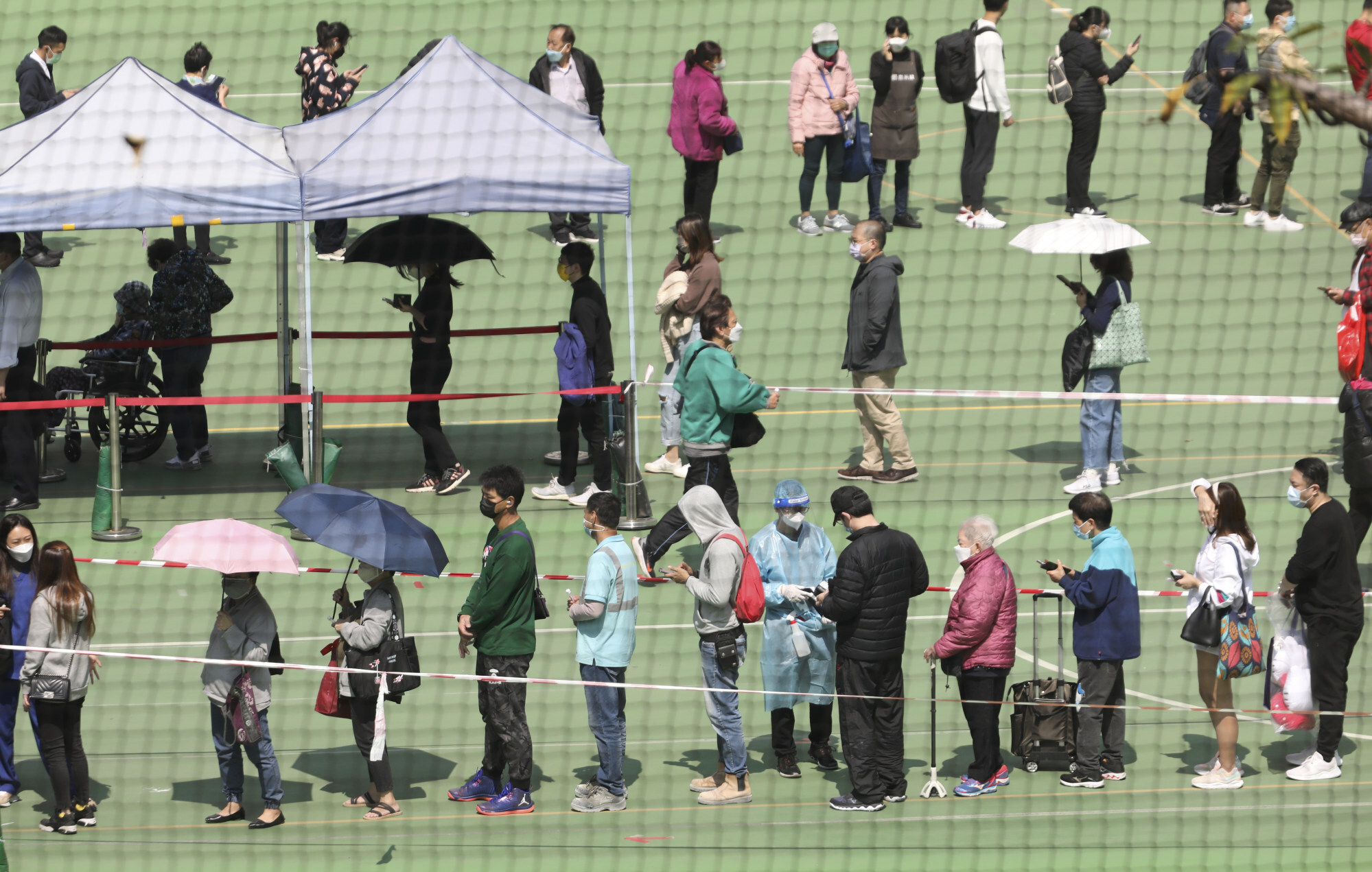 People queue up for testing at a mobile specimen collection station in Mong Kok on Tuesday. Photo: Jelly Tse
