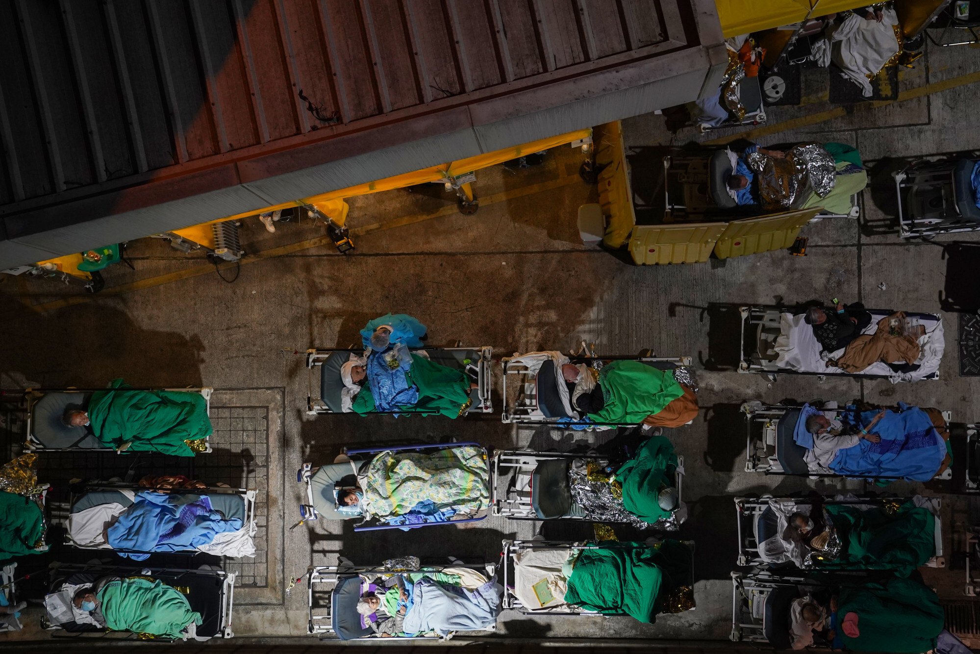 Patients wait at a temporary holding area outside Caritas Medical Centre in Sham Shui Po. Photo: Sam Tsang