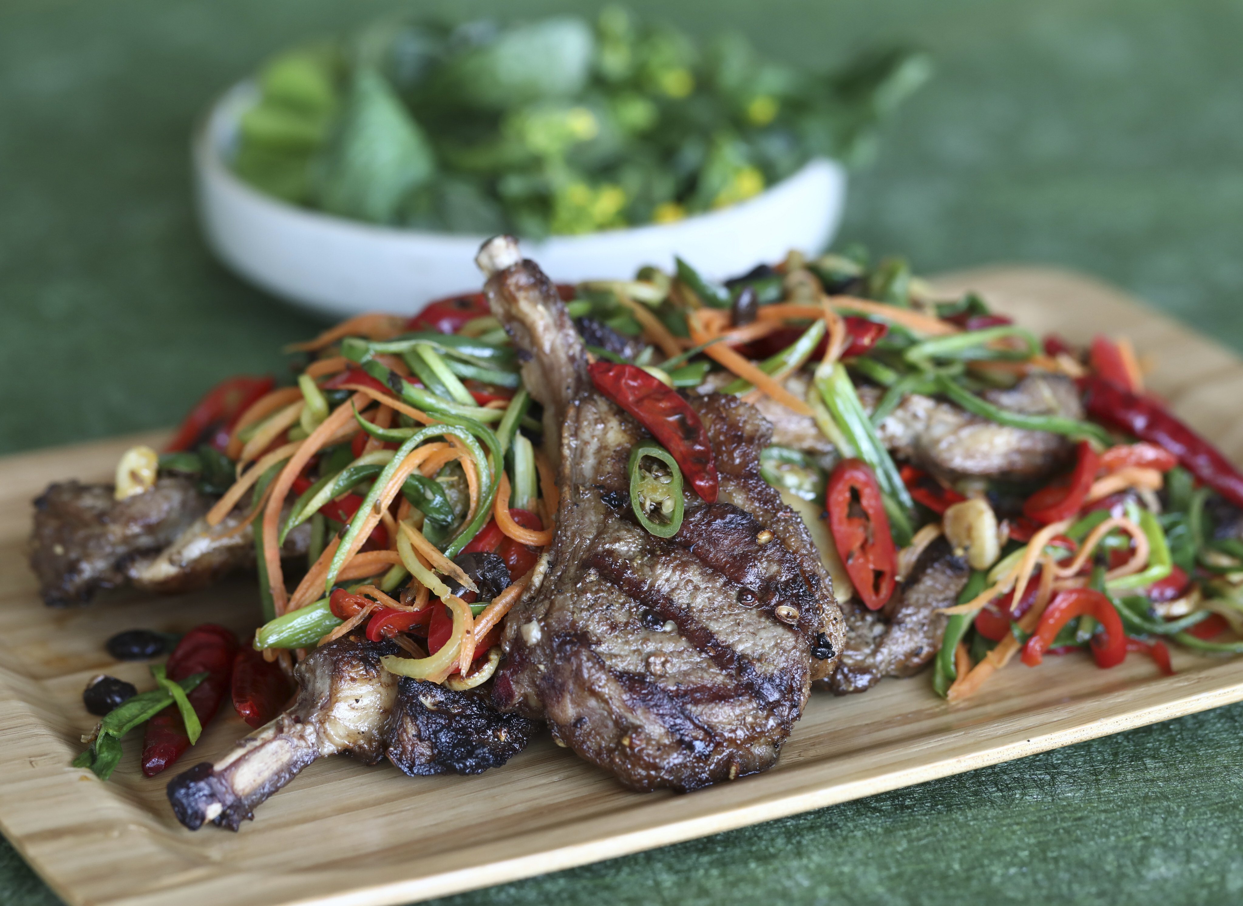 Grilled lamb chops with stir-fried vegetables spicy numbing and full of freshness. Photo: Jonathan Wong
