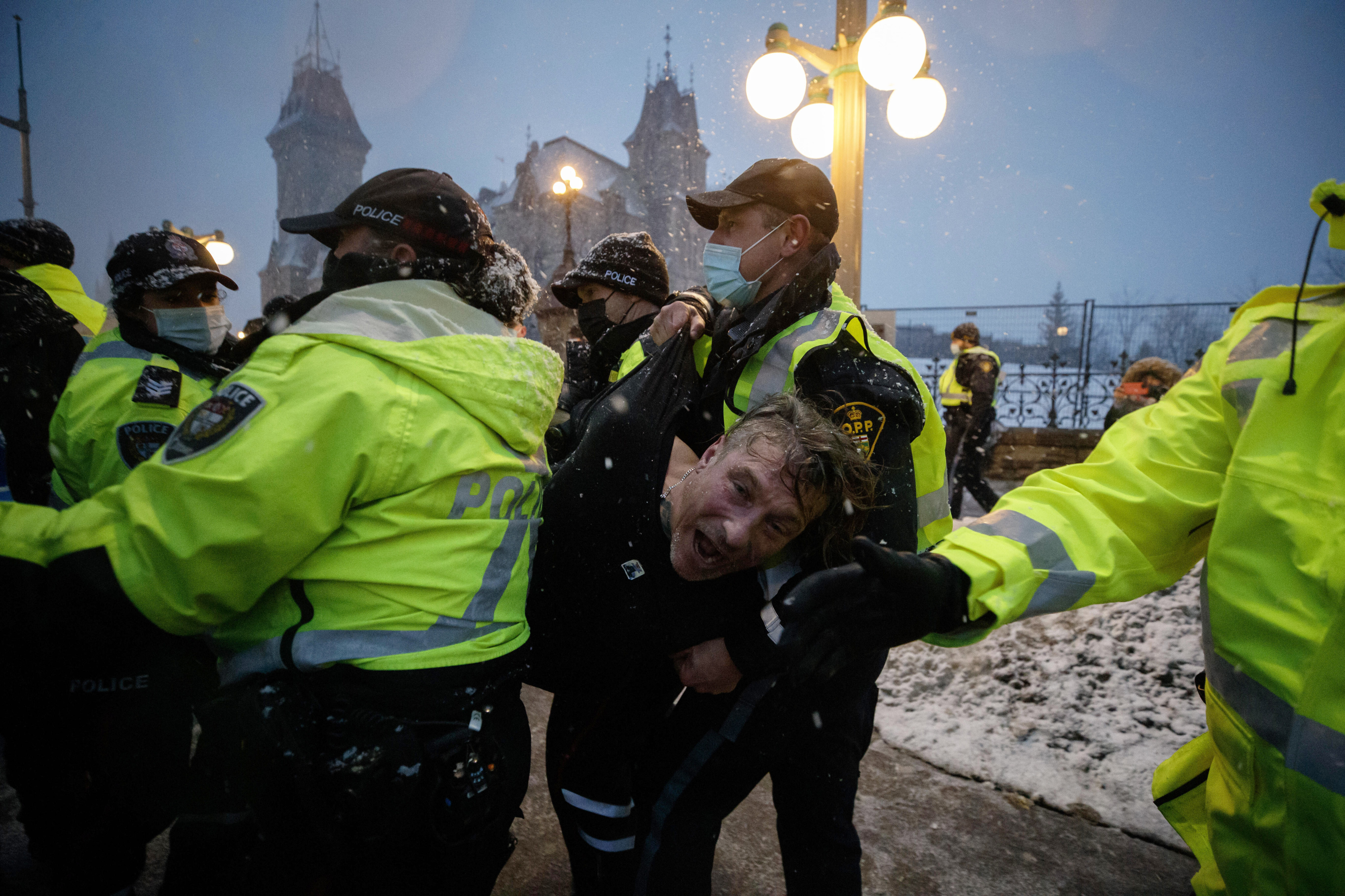 A man is arrested in Ottawa on Thursday as police move in on protesters. Photo: AP