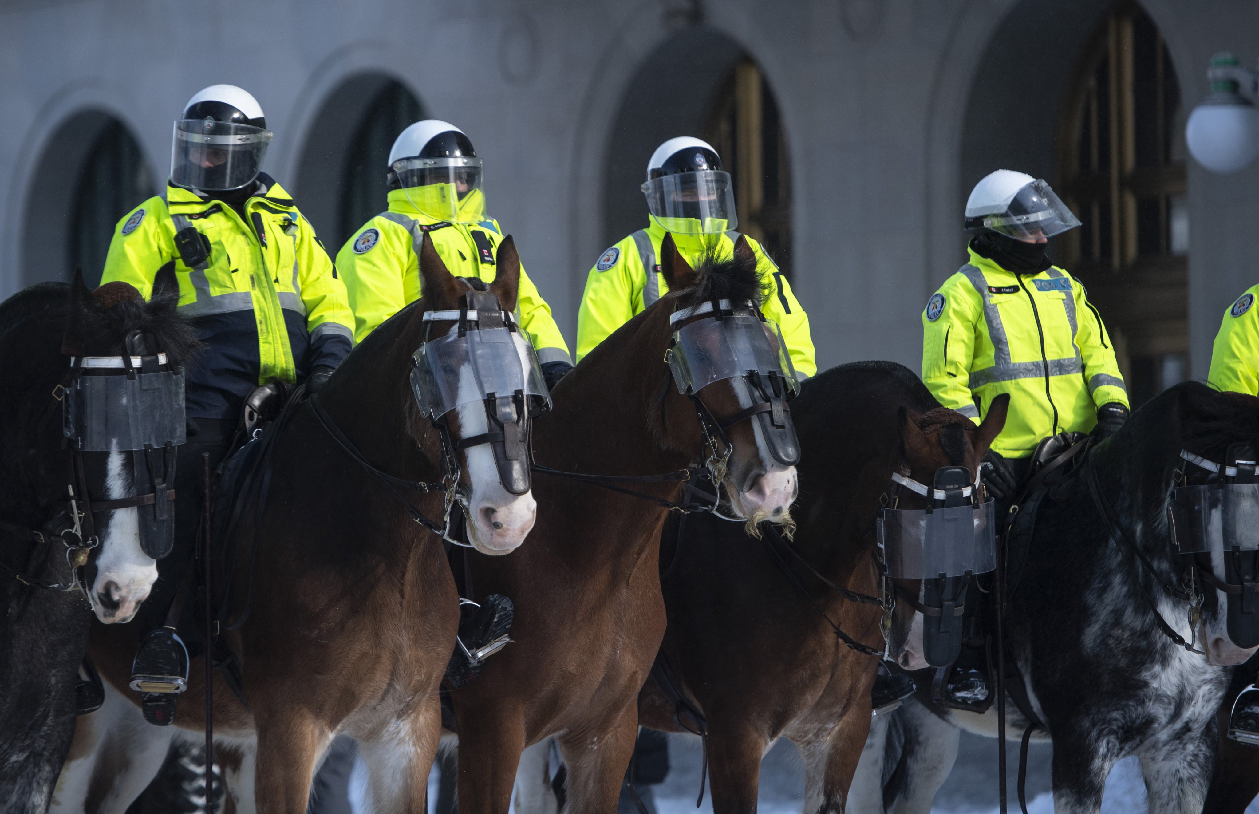 A mounted police unit stands by as officers work to clear the protesters in Ottawa. Photo: The Canadian Press via AP