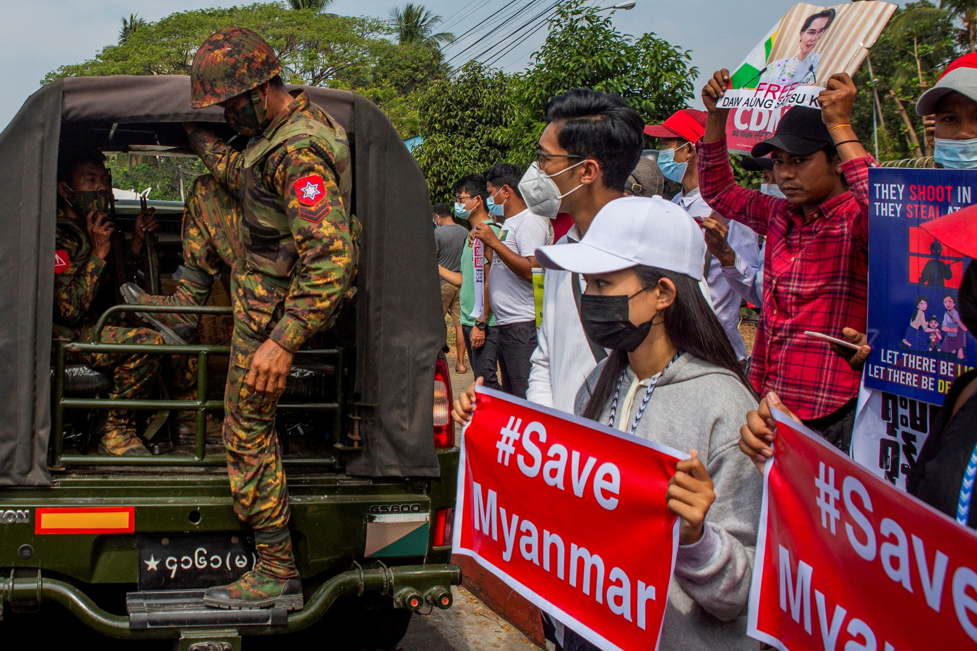 A soldier steps out of a military vehicle as protesters rally against the military coup in Yangon. File photo: Reuters