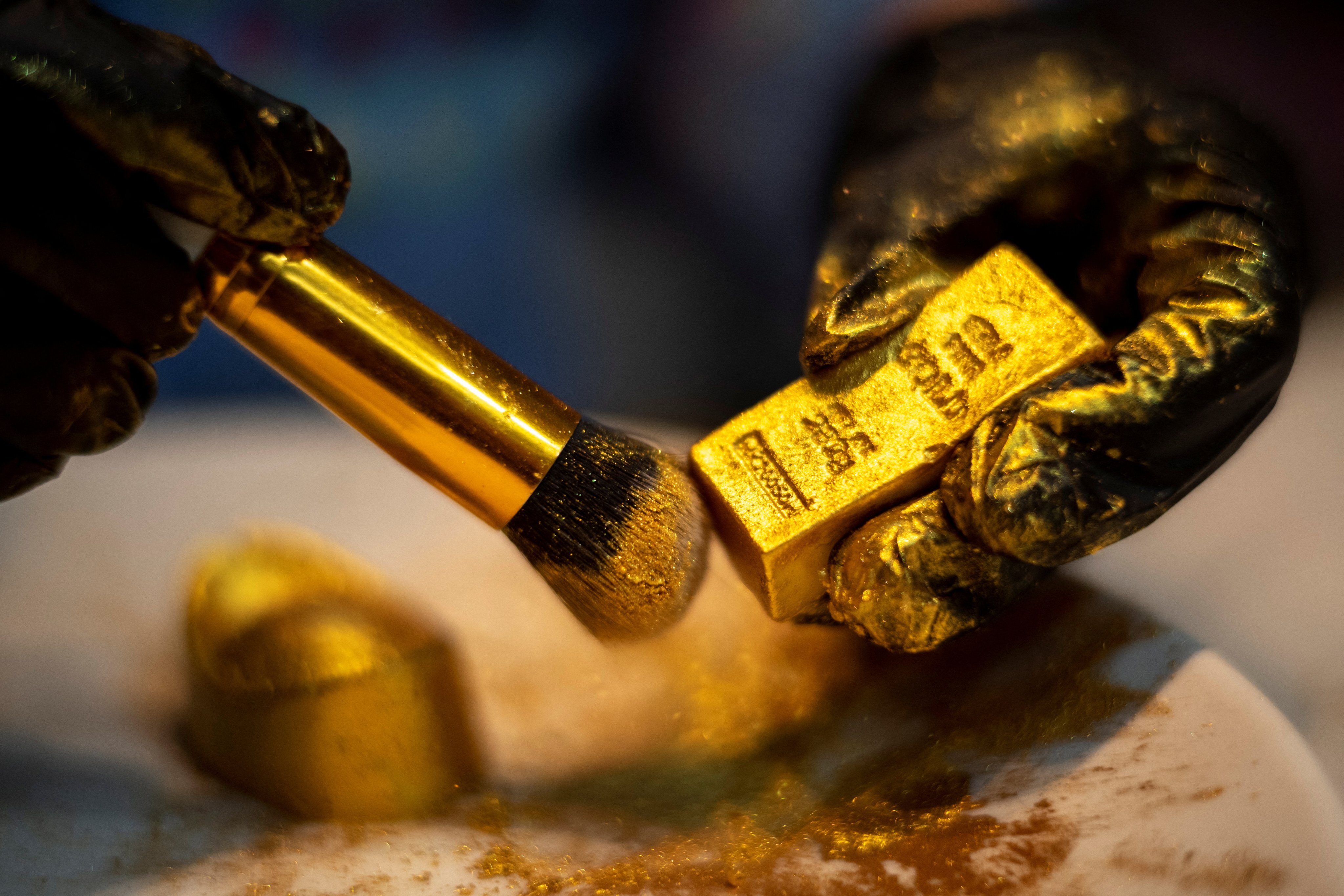 The yellow metal climbed to an eight-month high of US$1,940 per ounce on Thursday. Photo: Reuters