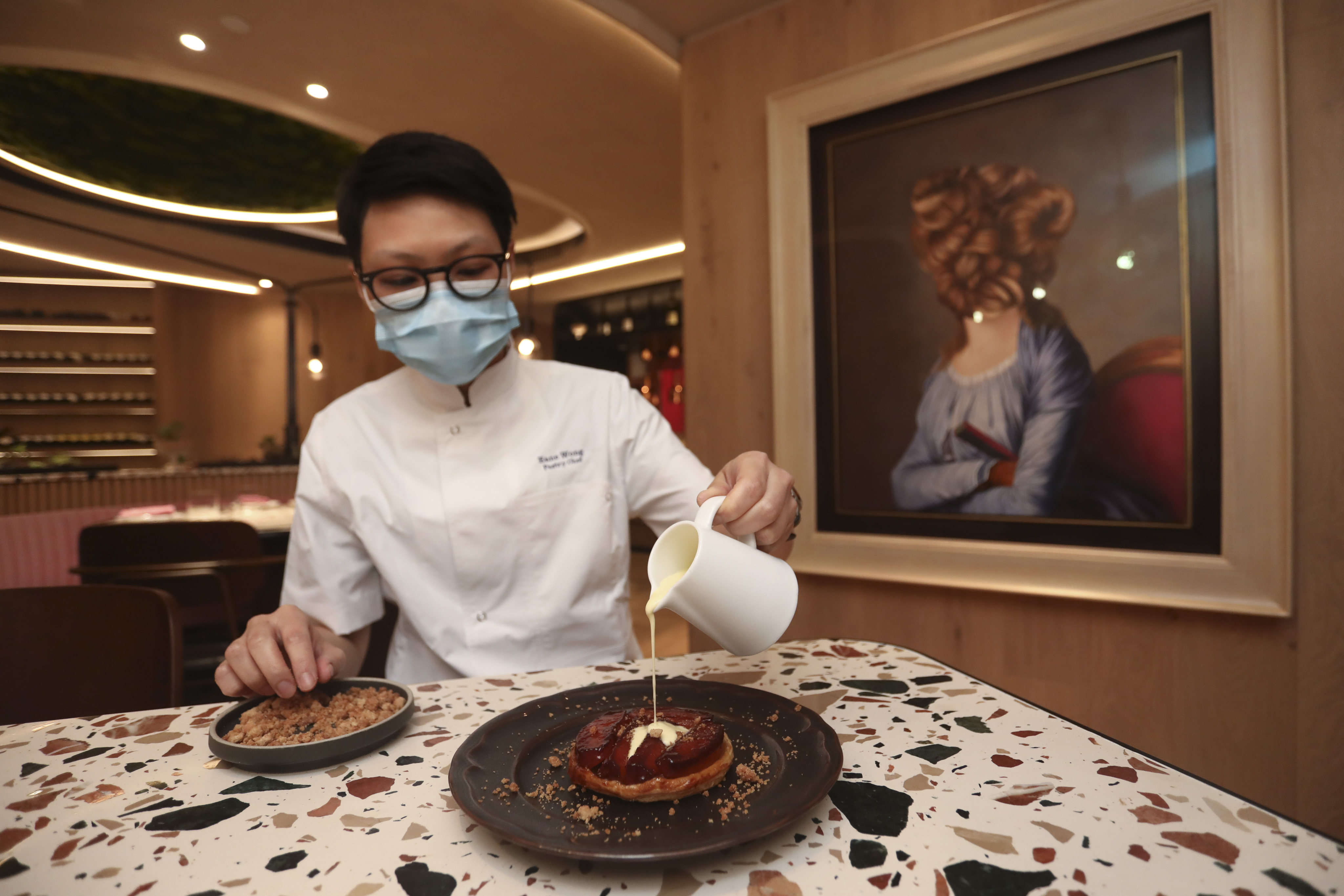 Pastry chef Eane Wong preparing apple vanilla tarte Tatin at Margo in Central, Hong Kong. Photo: SCMP/Jonathan Wong