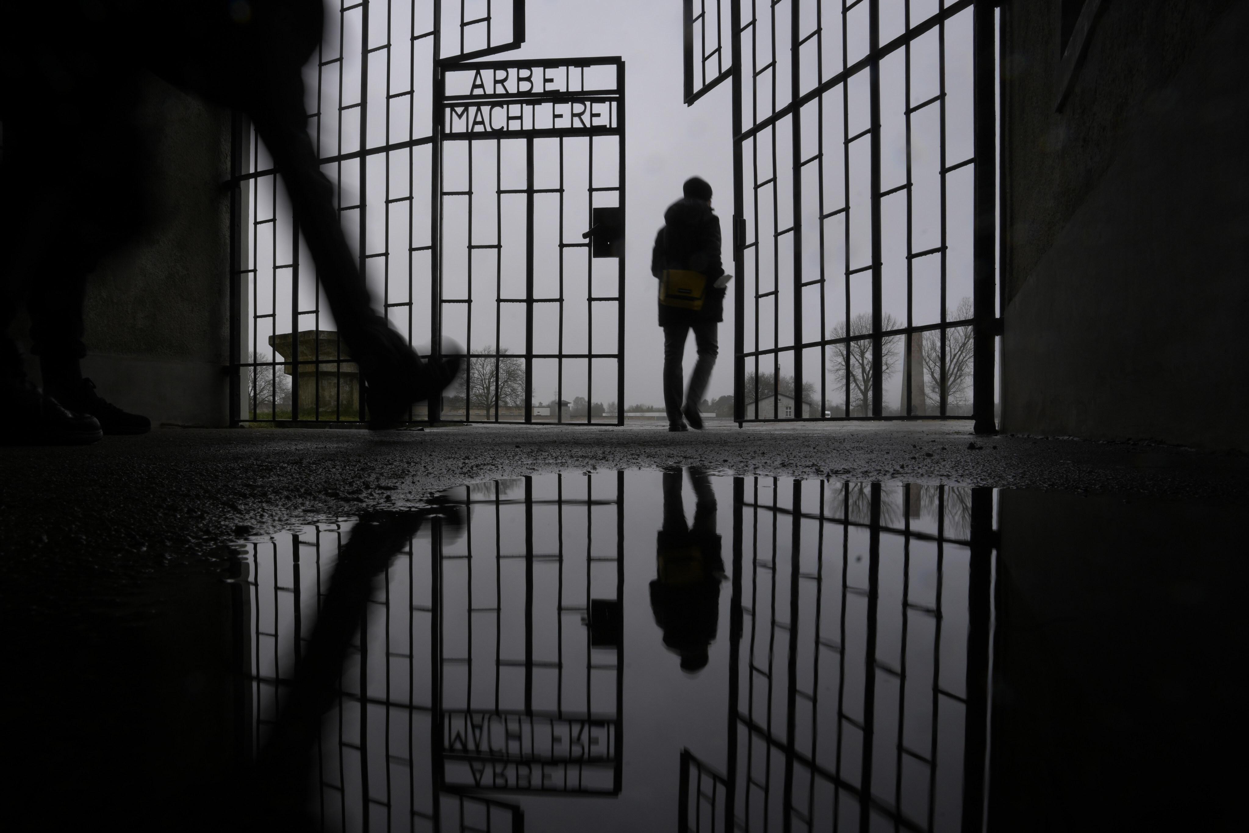 People enter the Sachsenhausen Nazi death camp through the gate with the phrase “Arbeit macht frei” (work sets you free) in Oranienburg, about 30km north of Berlin, Germany, on January 25. Photo: AP 