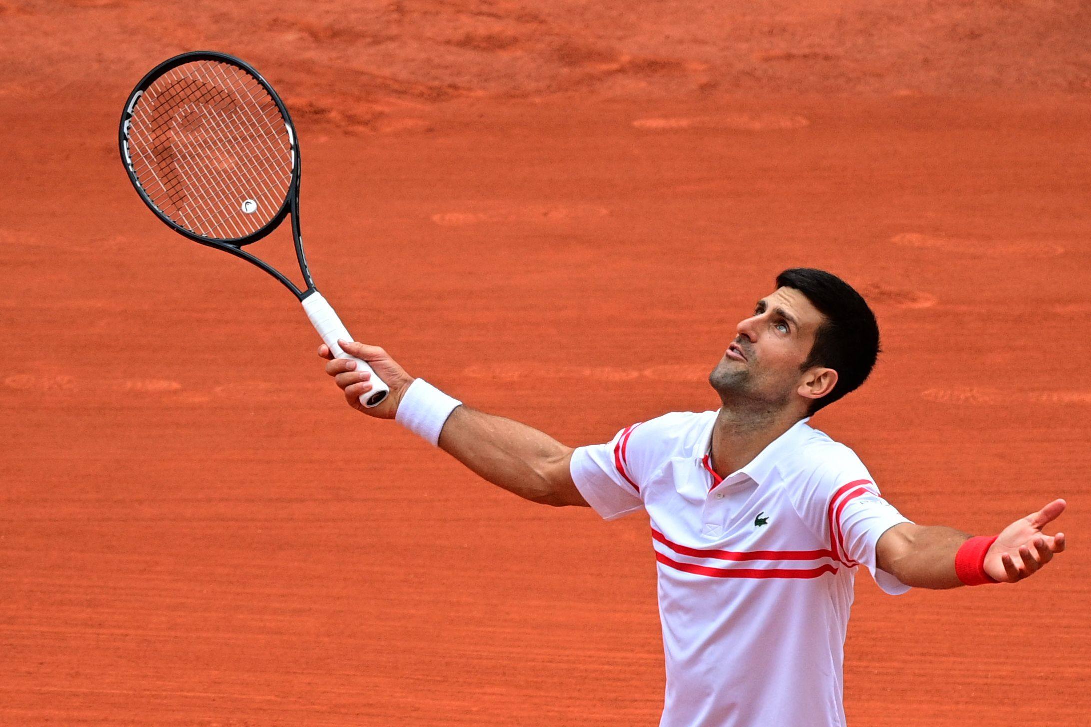 Serbia’s Novak Djokovic reacts after winning a point against Italy’s Lorenzo Musetti during his men’s singles fourth round tennis match at the 2021 French Open in Paris. Photo: AFP