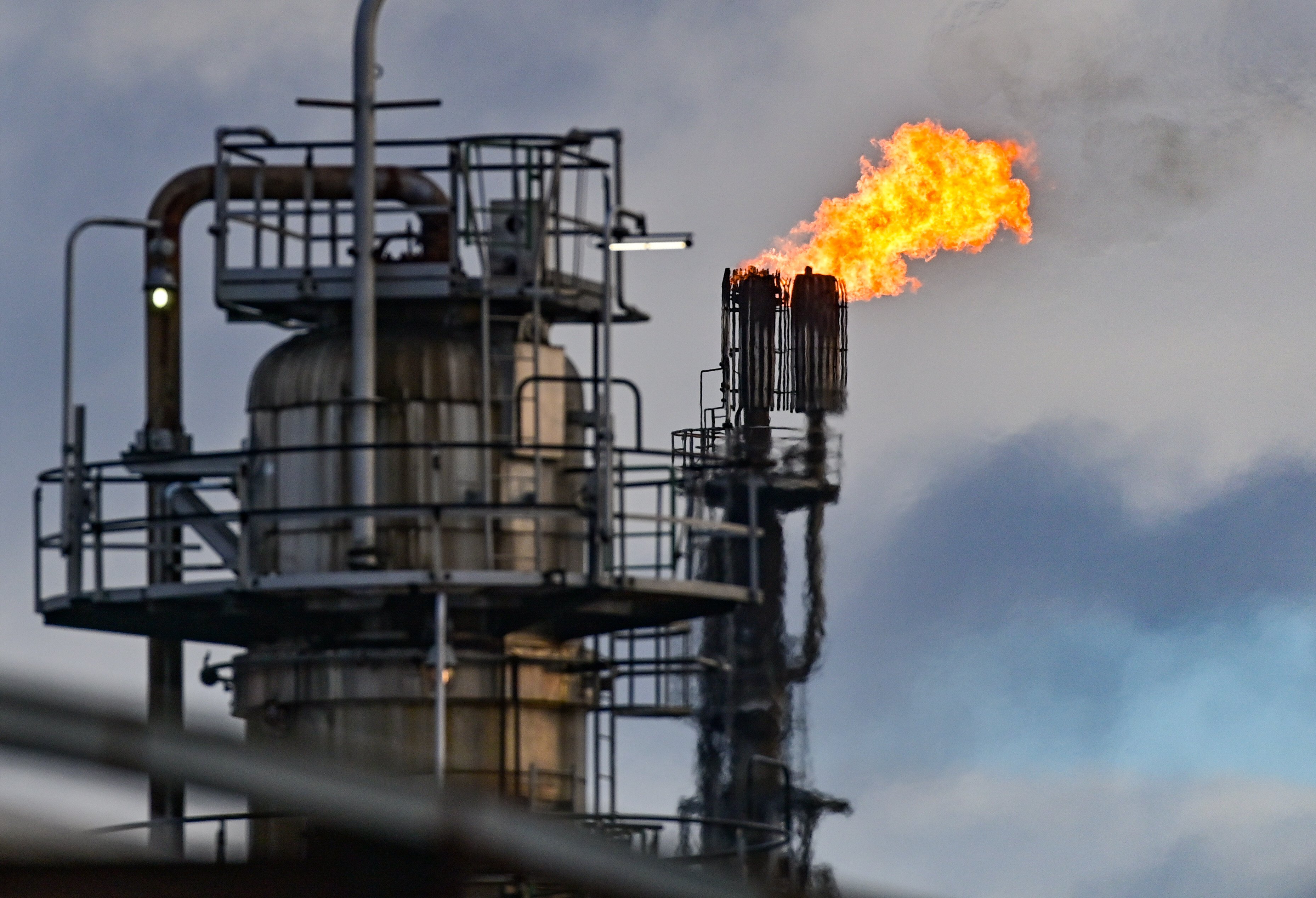 Surplus gas is burnt off at the crude oil processing plant of PCK Raffinerie in Brandenburg, Germany on February 25. The German government says it will free up some of its national oil reserves in response to the conflict in Ukraine and rising oil prices. Photo: DPA