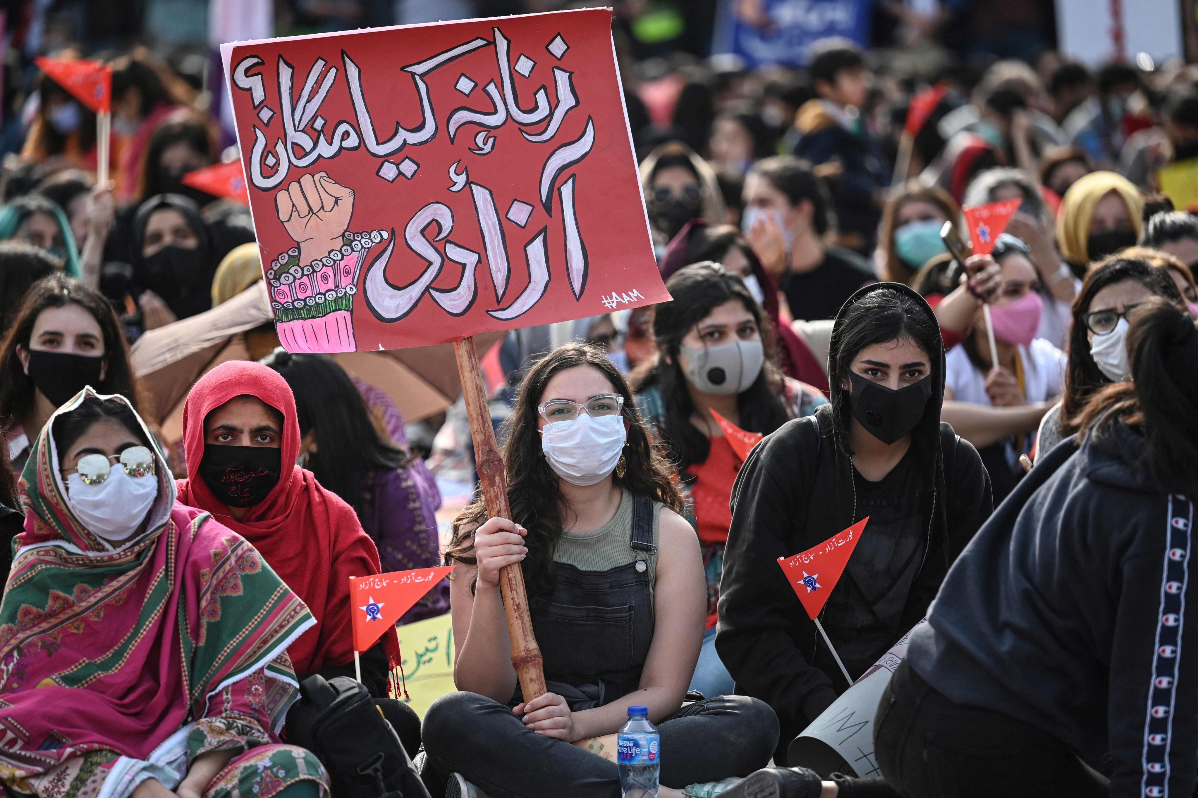 Aurat March activists carry placards during a rally to mark International Women’s Day in Islamabad on March 8, 2021. Photo: AFP 