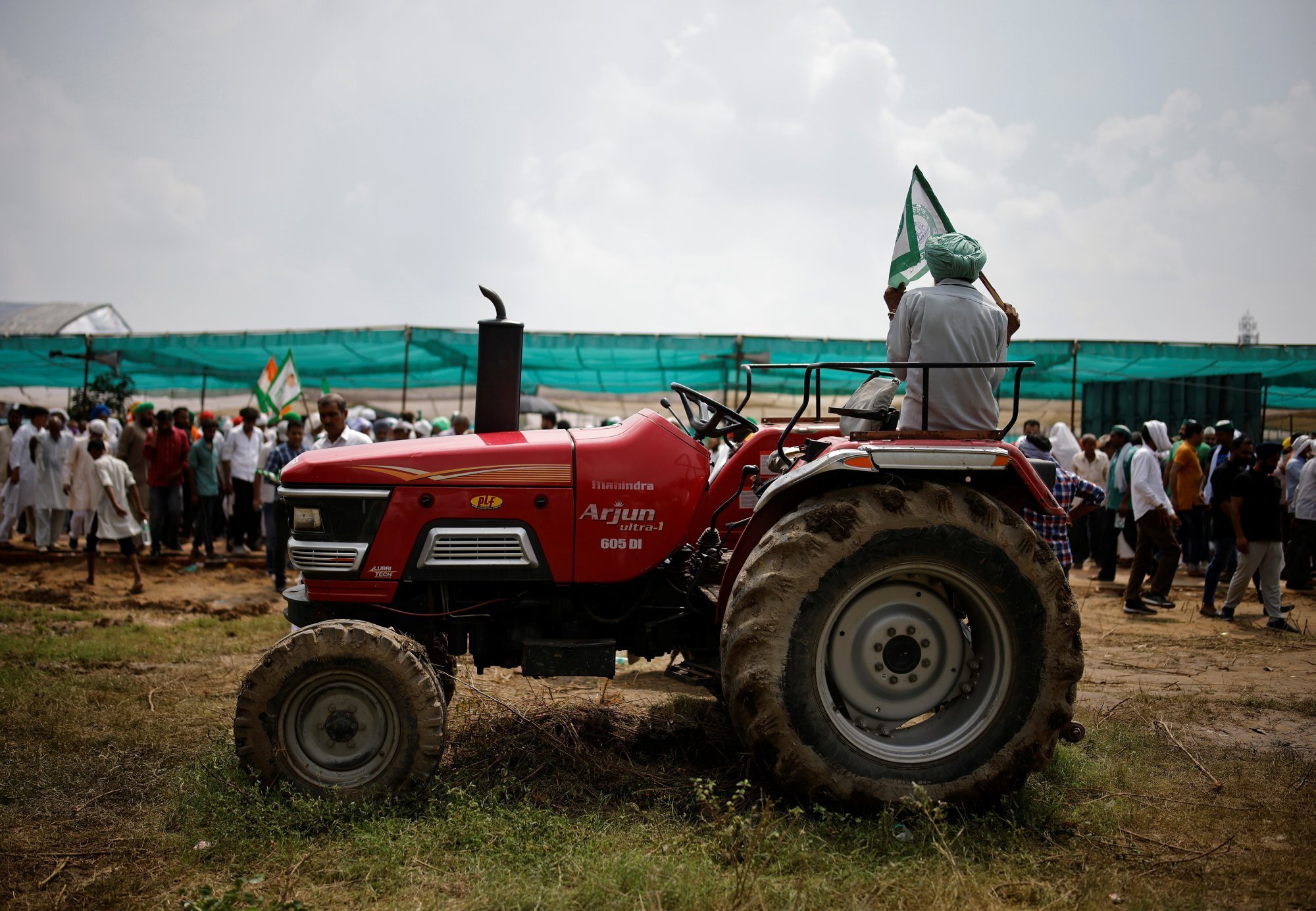 A farmer sits on a tractor as he attends a Maha Panchayat or grand village council meeting as part of a protest against farm laws in the northern state of Uttar Pradesh, India, in September 2021. Photo: Reuters