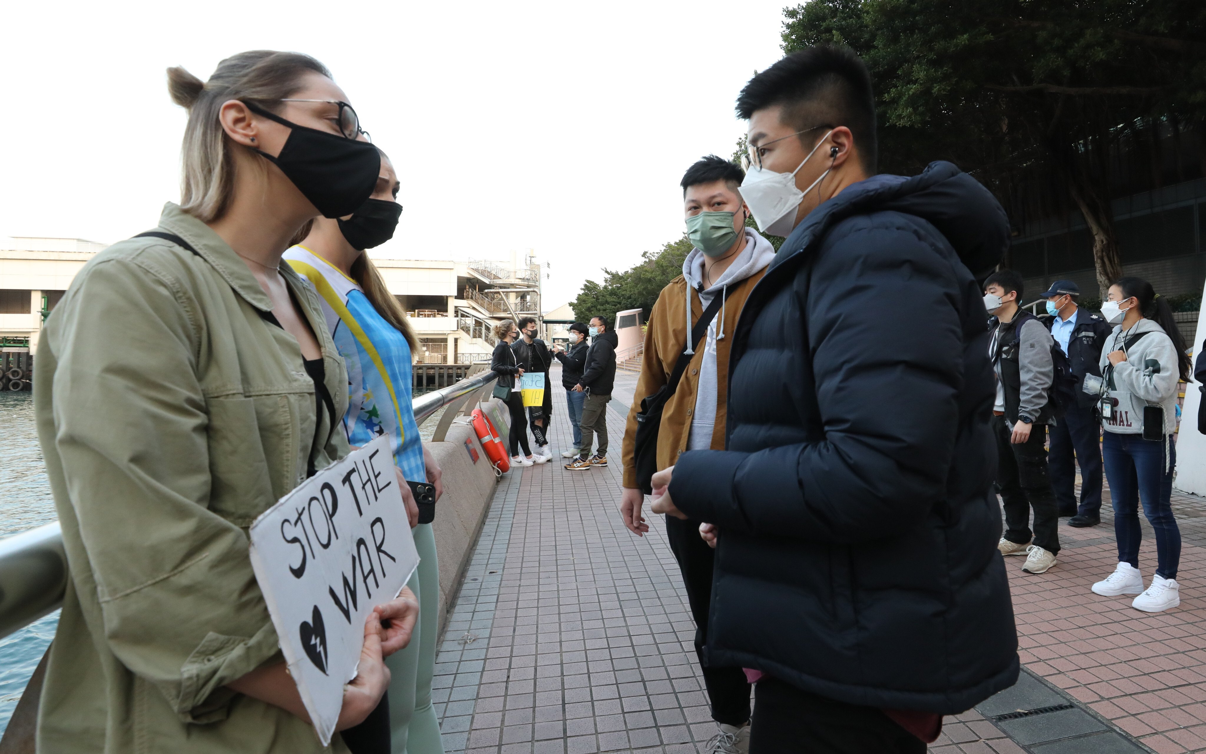 Russians and Ukrainians in Hong Kong protest against the Russian invasion of Ukraine, outside Central Ferry Pier No.3 in Central on February 25. Photo: Jelly Tse