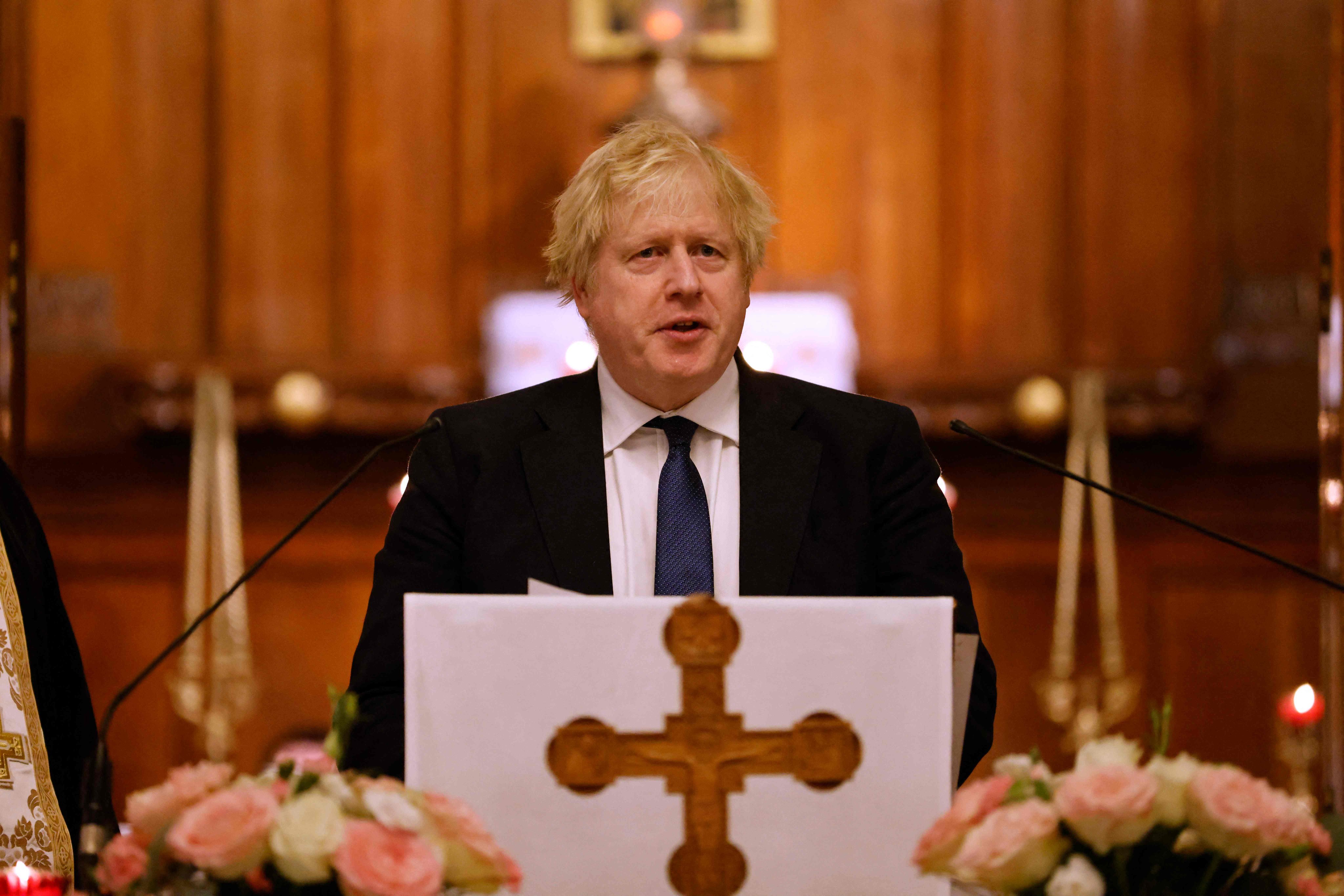 Britain’s Prime Minister Boris Johnson speaks to members of the Ukrainian community at The Cathedral of the Holy Family in central London. Photo: AFP