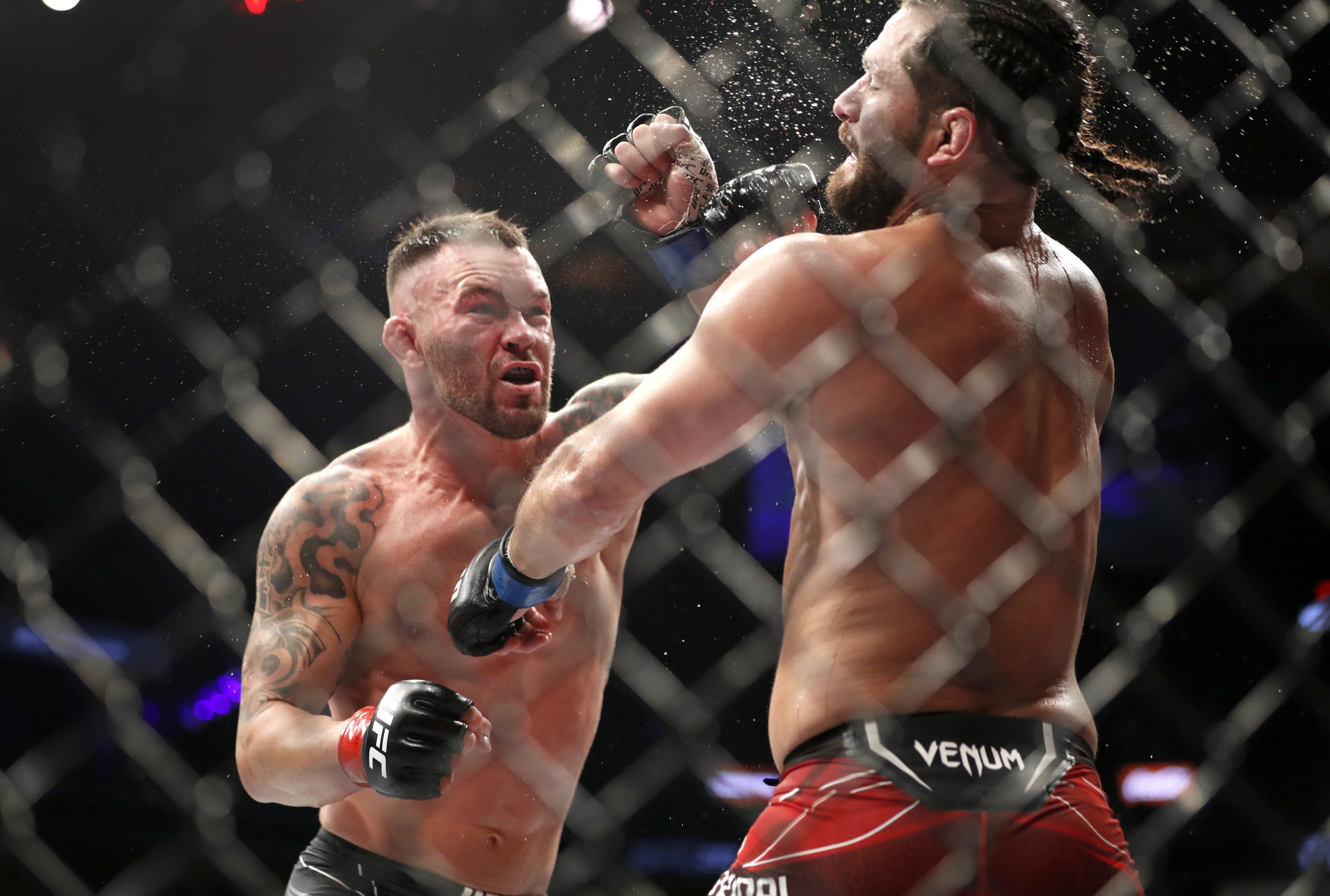 Colby Covington connects with a punch on Jorge Masvidal in the five-round main event at UFC 272. Photo: Steve Marcus/Las Vegas Sun via AP