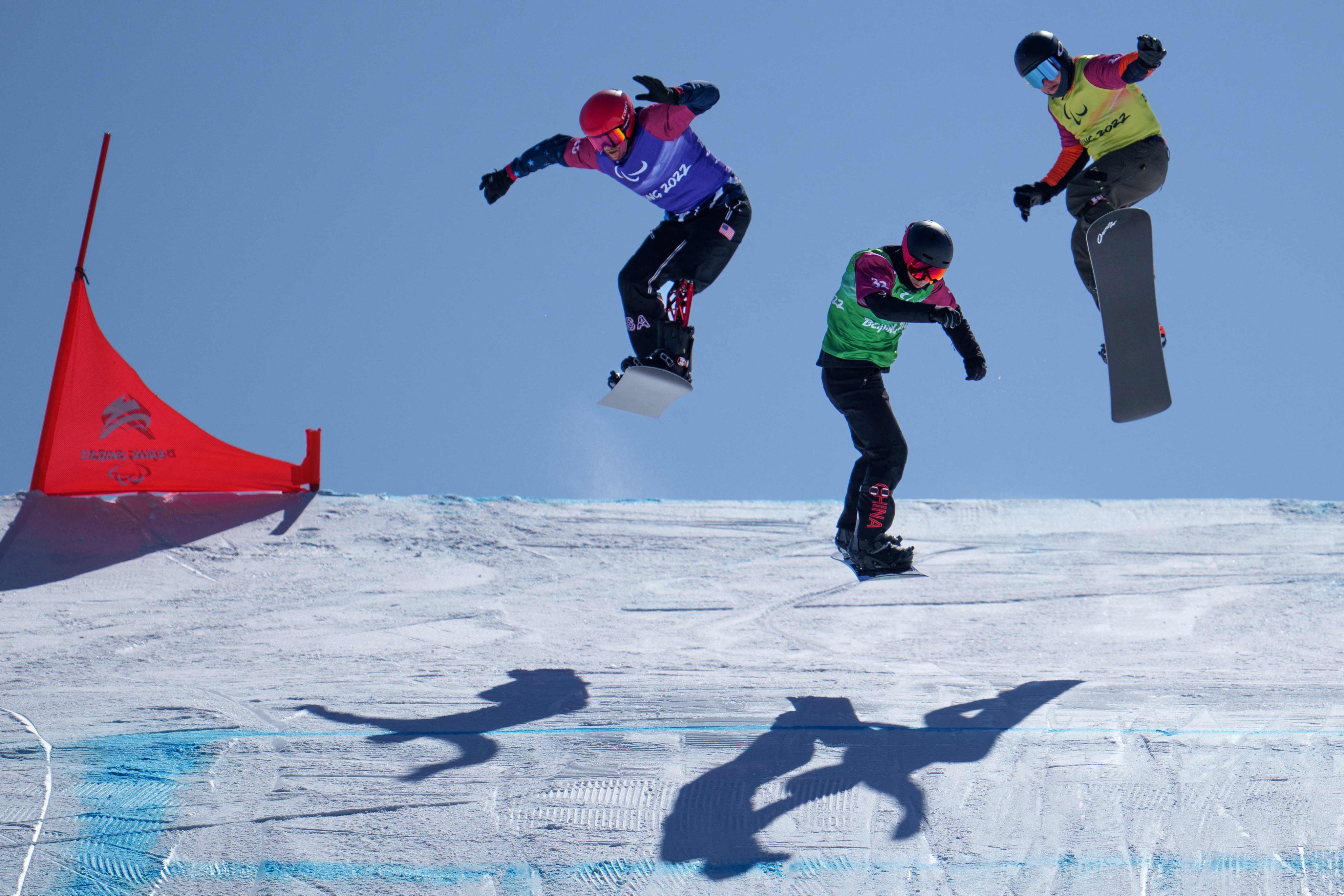 Snowboarders in action on day 3 of the Winter Paralympic Games. Photo: AFP