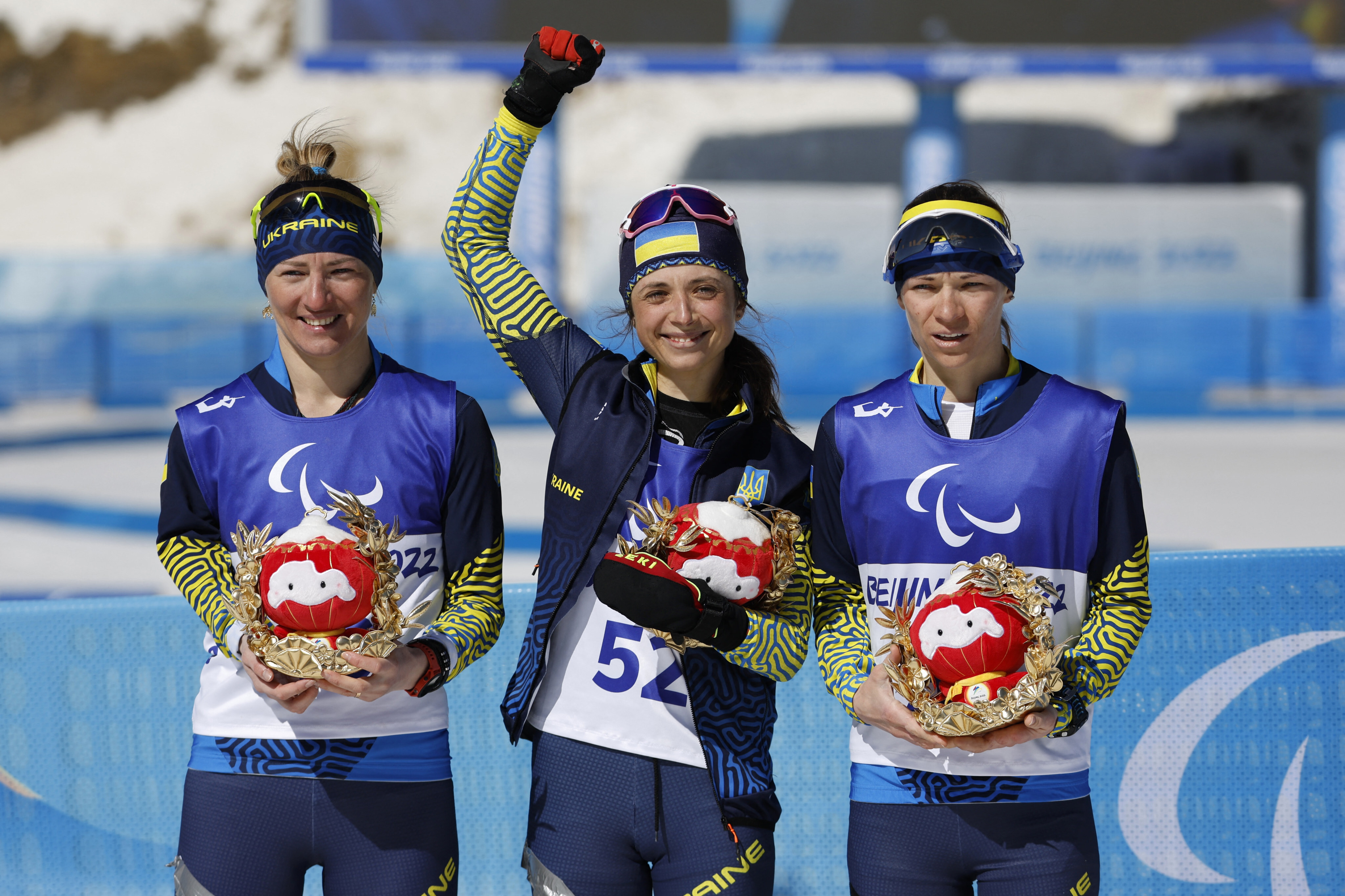 Iryna Bui of Ukraine celebrates winning gold with Ukraine teammates Oleksandra Kononova and Liudmyla Liashenko. Photo: Reuters