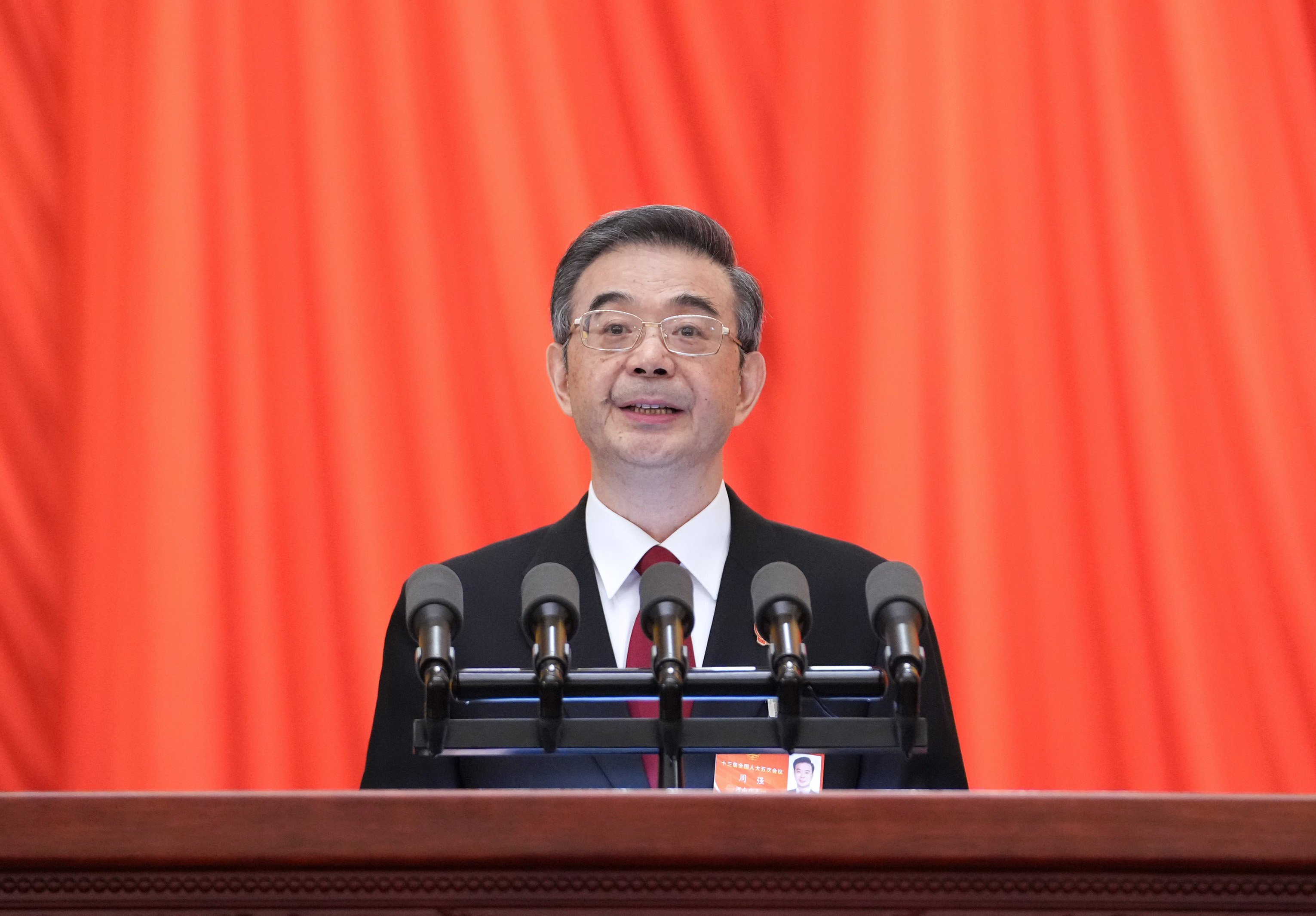 Chief Justice Zhou Qiang delivers the top court’s work report in Beijing on Tuesday. Photo: Xinhua