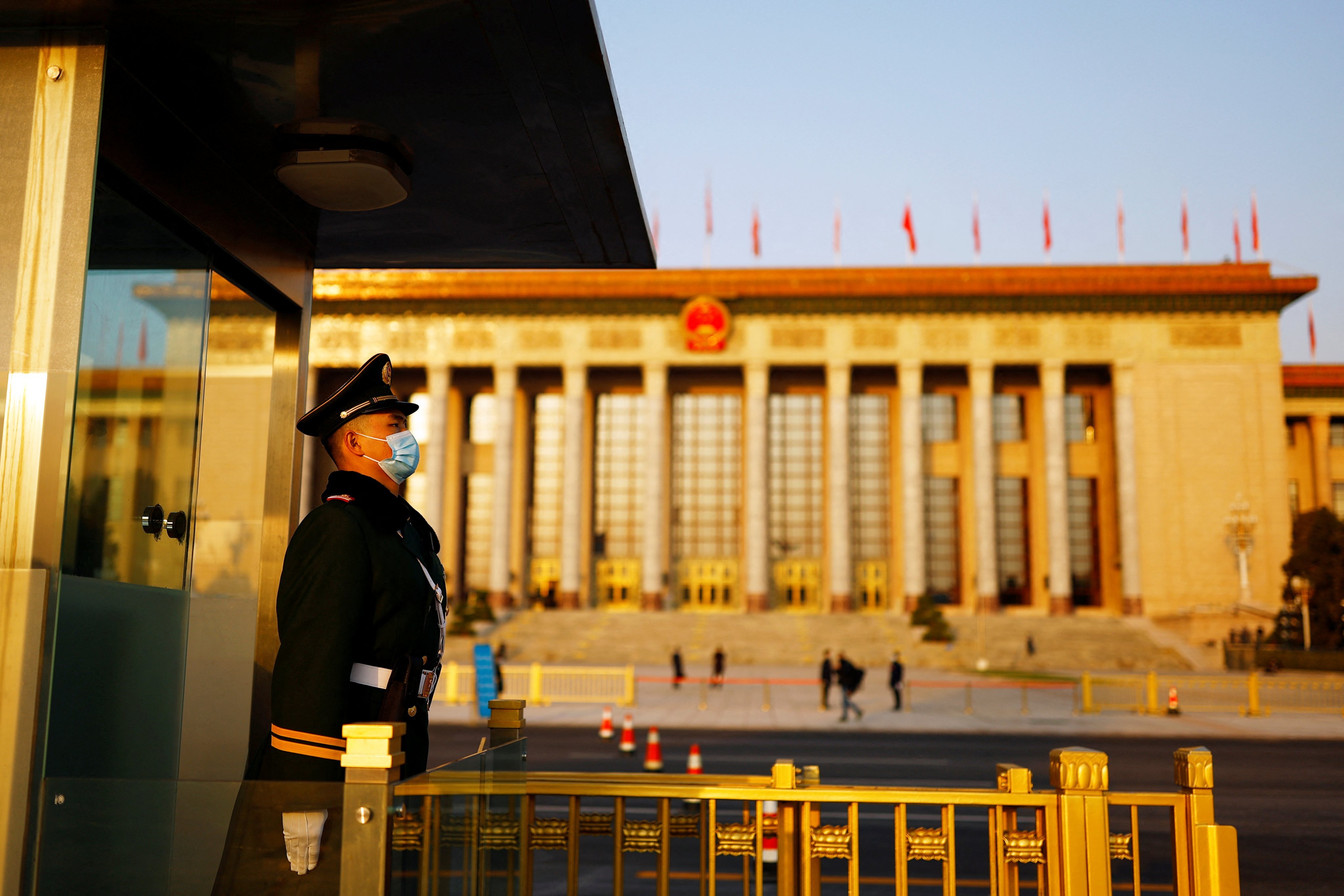 A  paramilitary police officer stands guard outside the Great Hall of the People before the second plenary session of the National People’s Congress in Beijing on Tuesday. Photo: Reuters