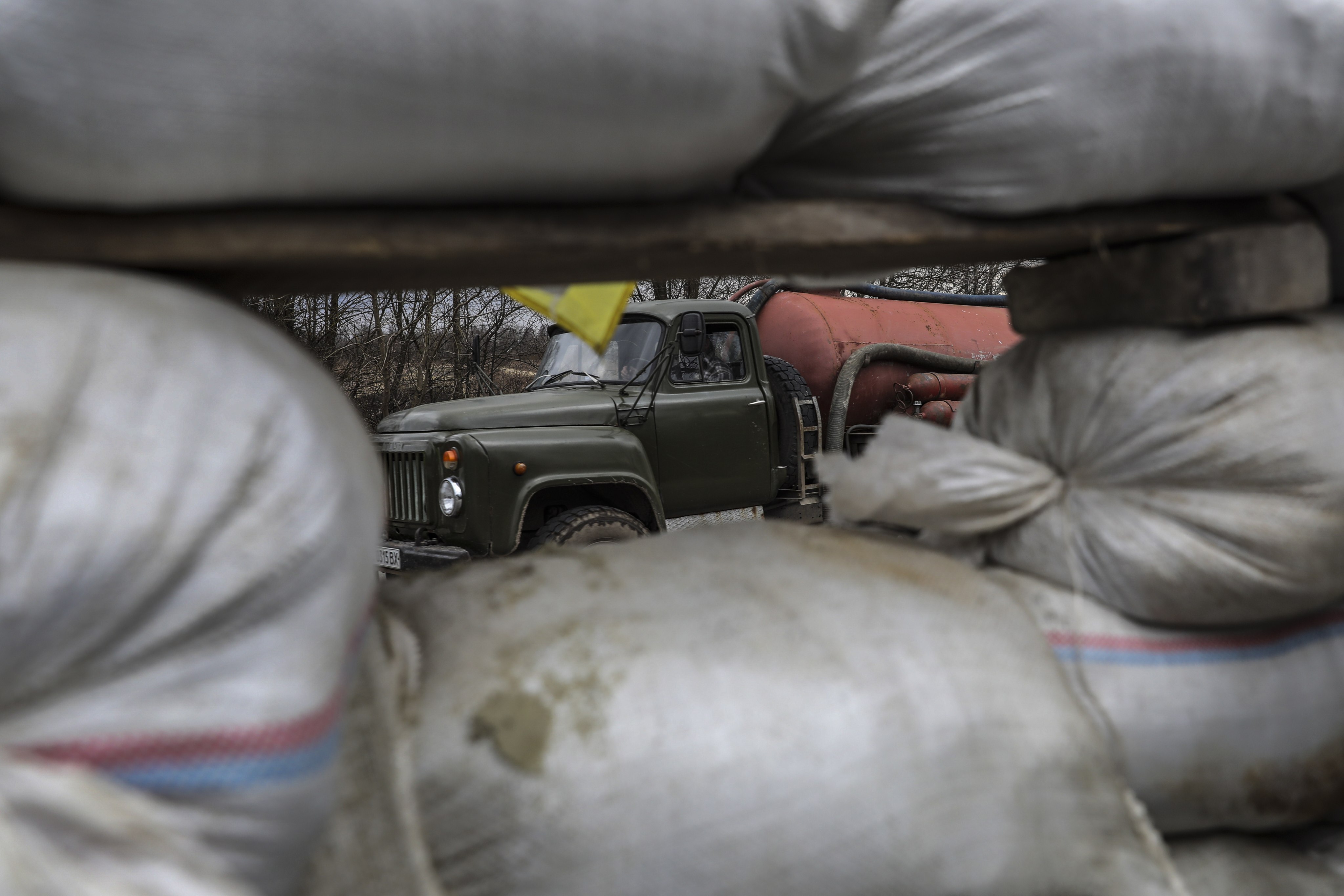 A truck passes a security check point run by residents near Lviv, Ukraine, on March 8. Photo: EPA-EFE