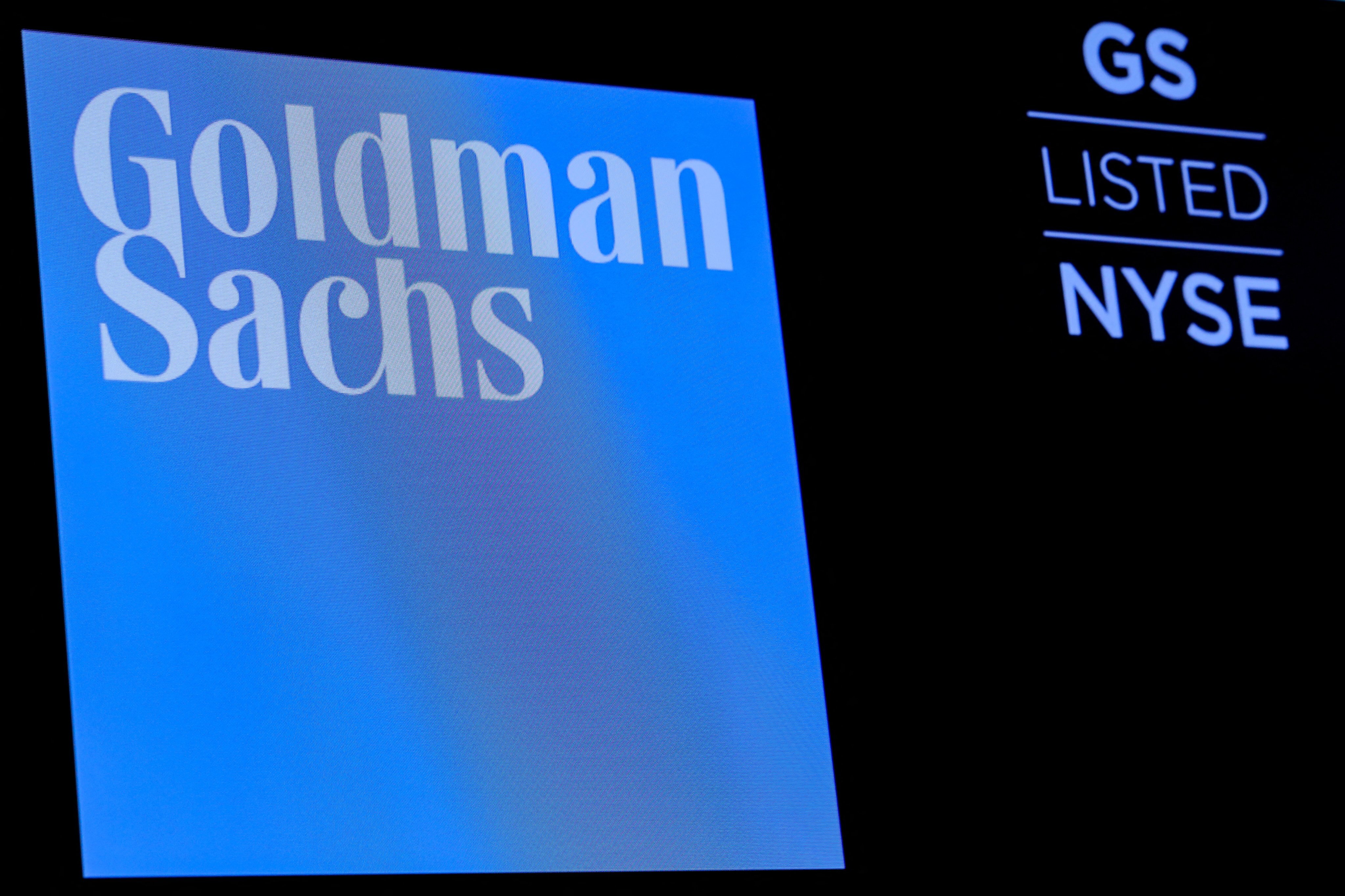 The ticker symbol and logo for Goldman Sachs is displayed on a screen on the floor at the New York Stock Exchange. Photo: Reuters