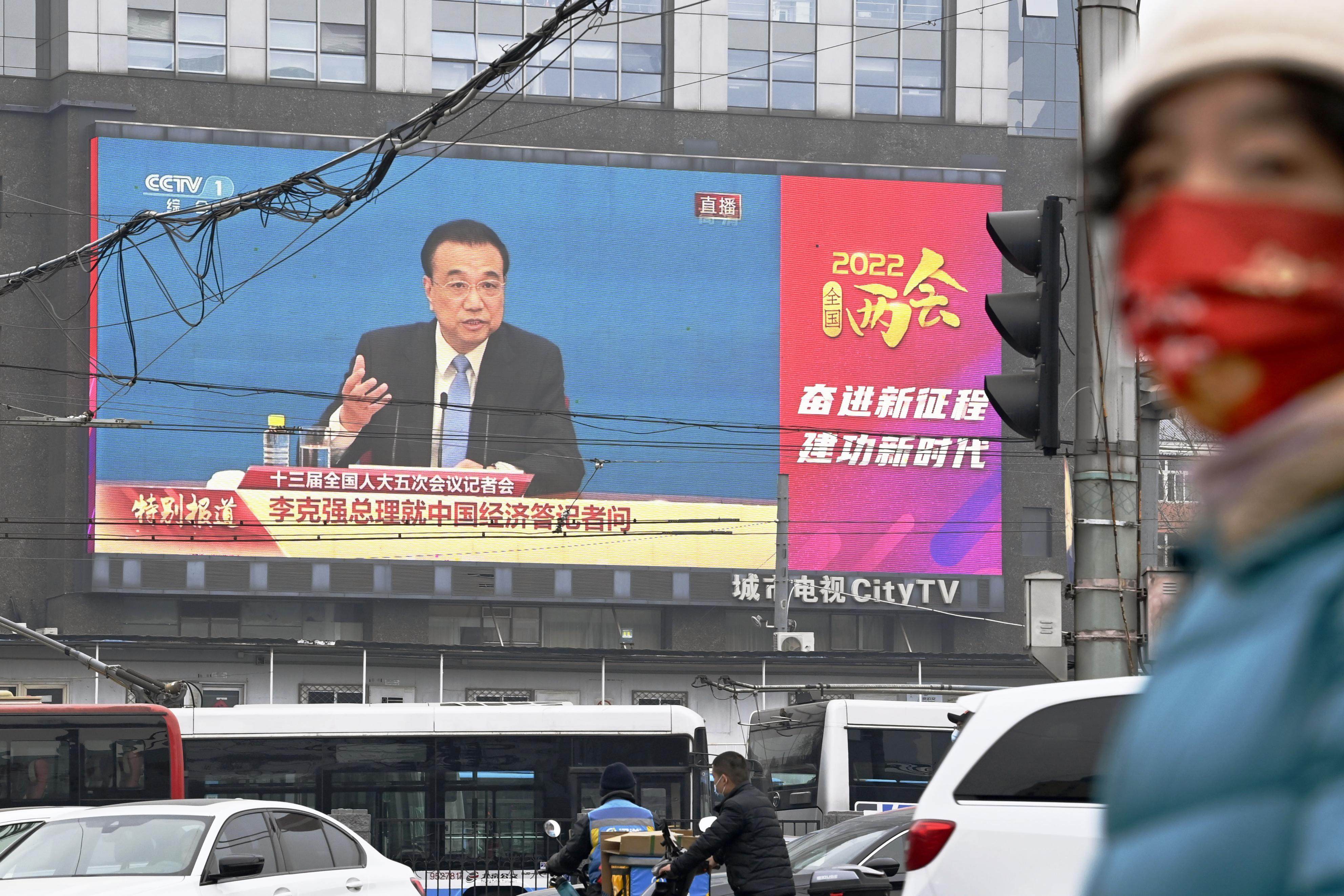 A large screen on a street in Beijing shows Chinese Premier Li Keqiang speaking at a press conference after the National People’s Congress closed on March 11, 2022. Photo: Kyodo