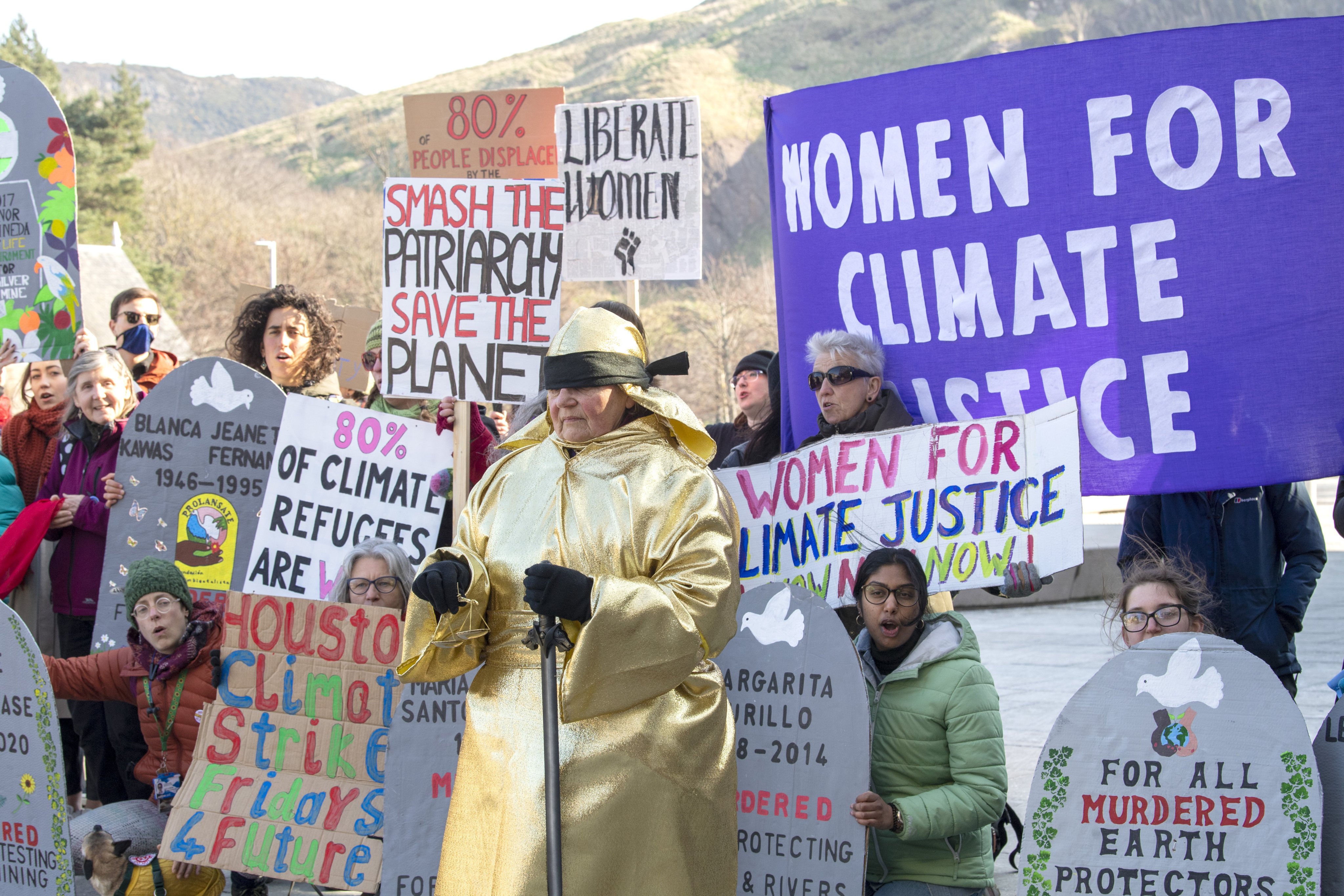 Activists hold a rally as part of the International Day of Women’s Climate Action, organised by the Women’s Climate Strike, to protest the disproportionate impacts of climate disruption on women. Photo: Lesley Martin/PA Wire/dpa