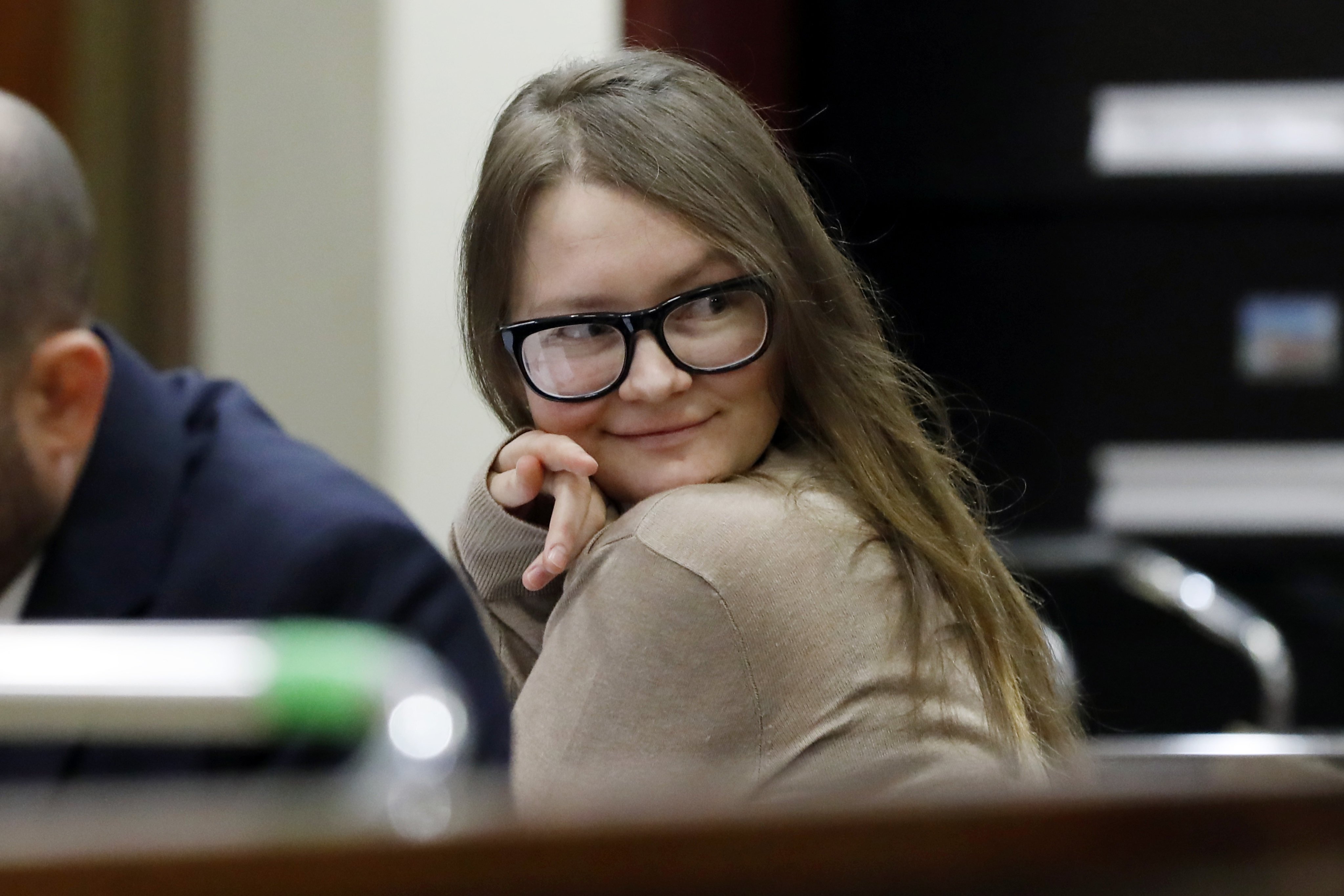 Anna Sorokin sits at the defense table in New York State Supreme Court, in New York, Wednesday, March 27, 2019. Sorokin, who claimed to be a German heiress, is on trial on grand larceny and theft of services charges. (AP Photo/Richard Drew)