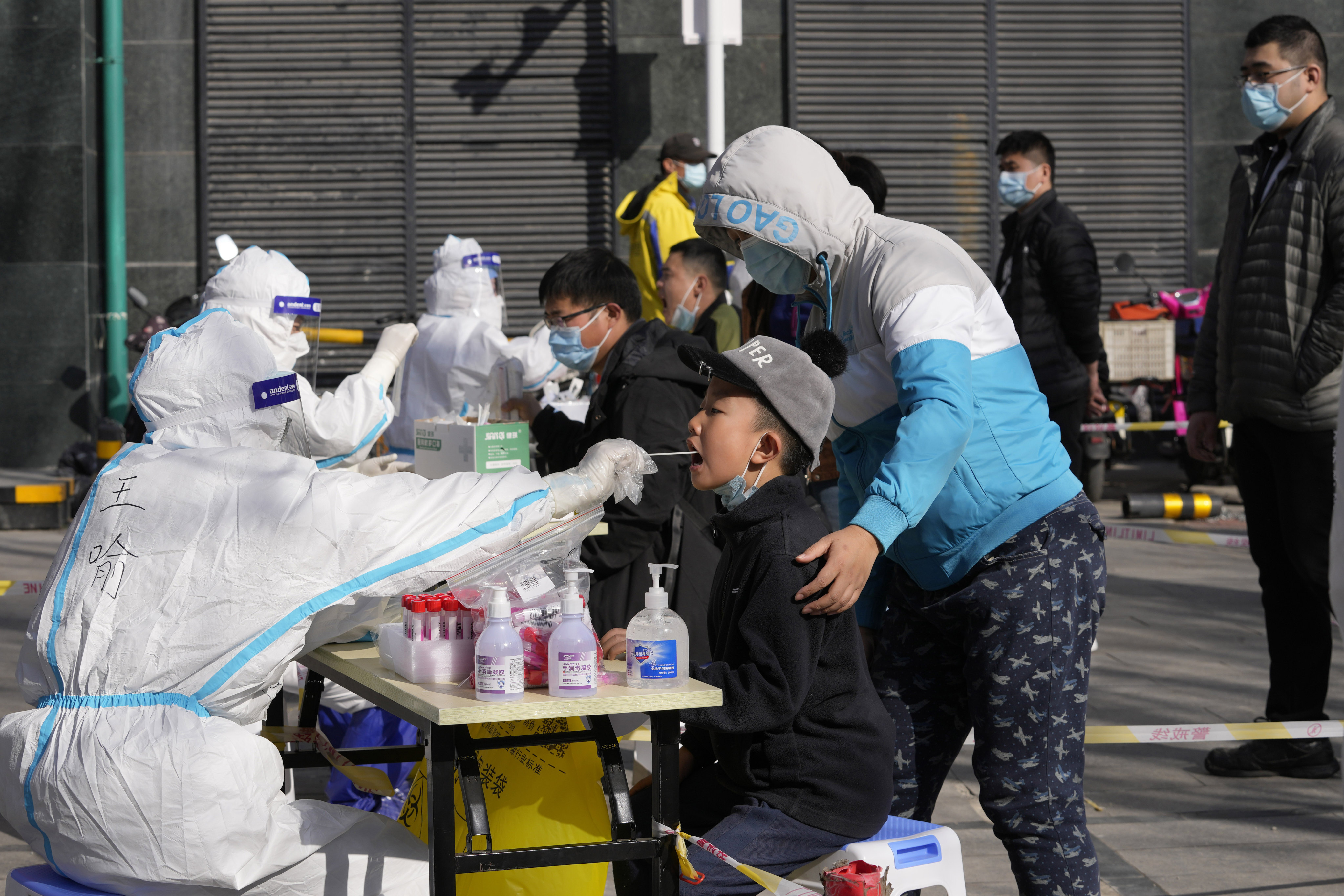 China remains committed to its strategy of lockdowns and mass testing to contain the coronavirus. Photo: AP