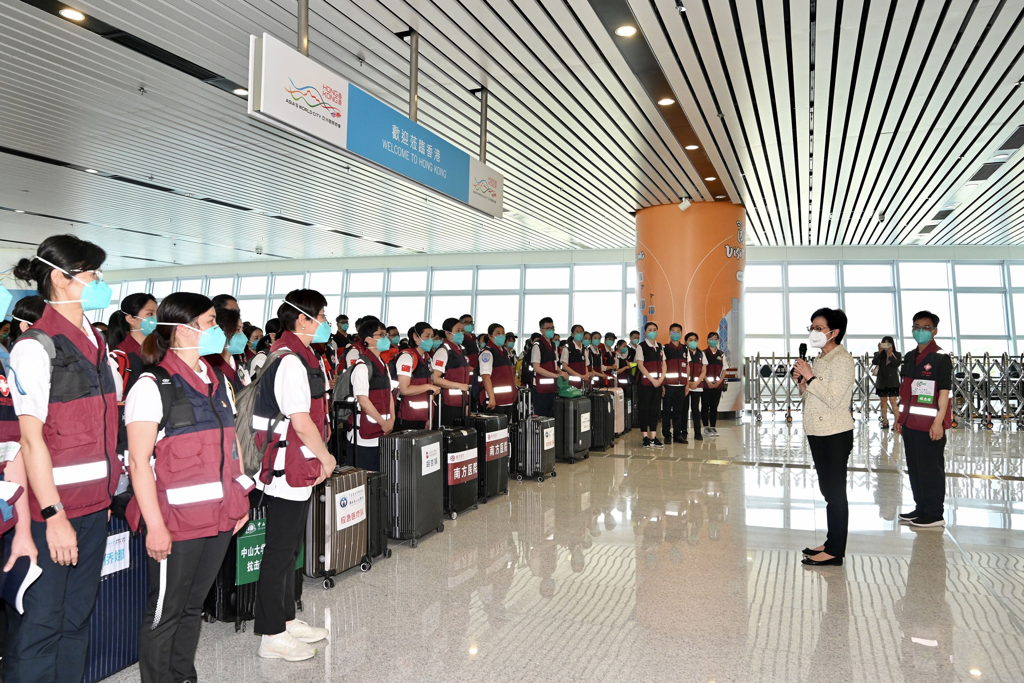 Chief Executive Carrie Lam speaks to a team of mainland Chinese medical workers now in the city to help out with anti-pandemic efforts. Photo: SCMP Pictures