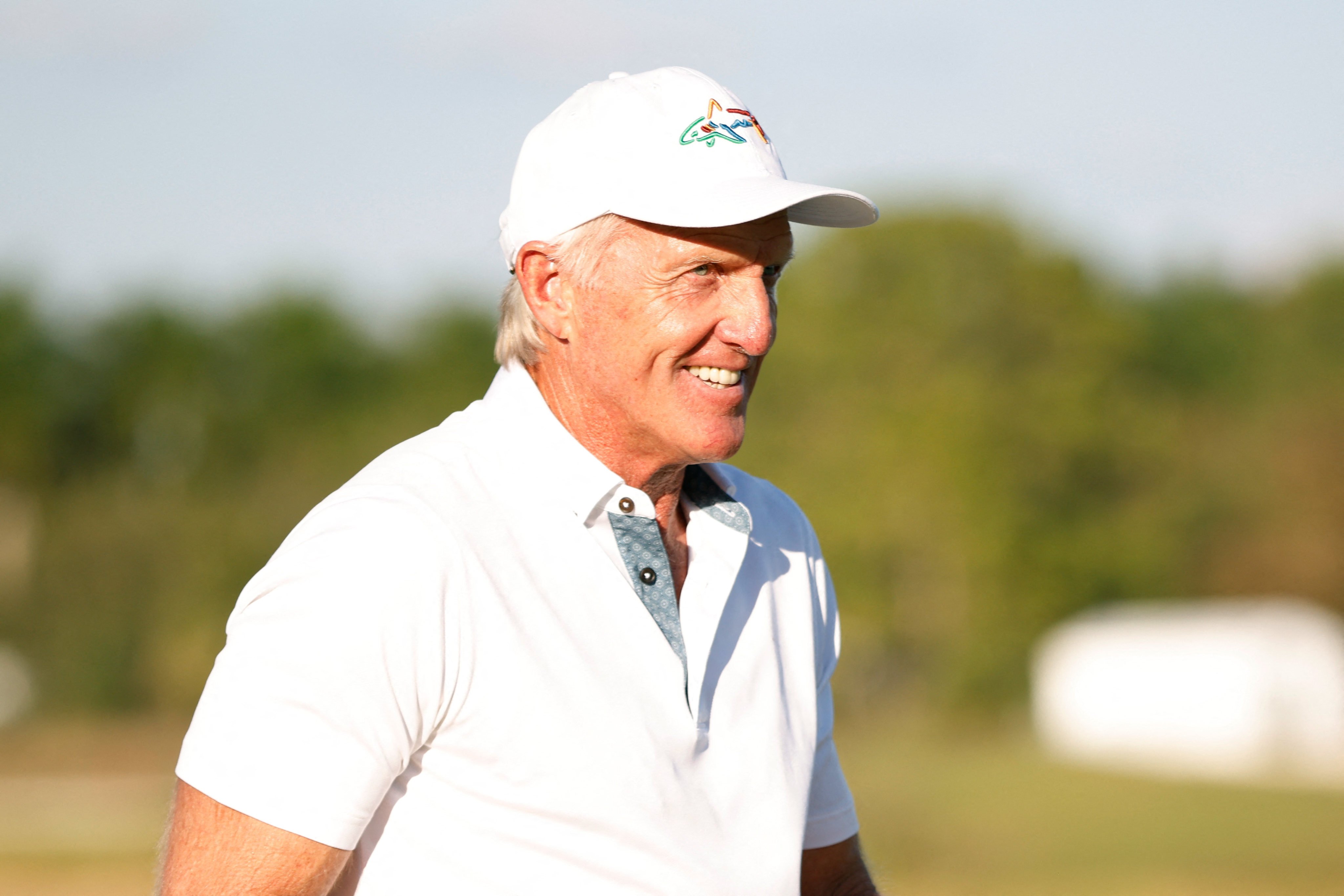 Greg Norman and players line up on the stage during the LIV Golf