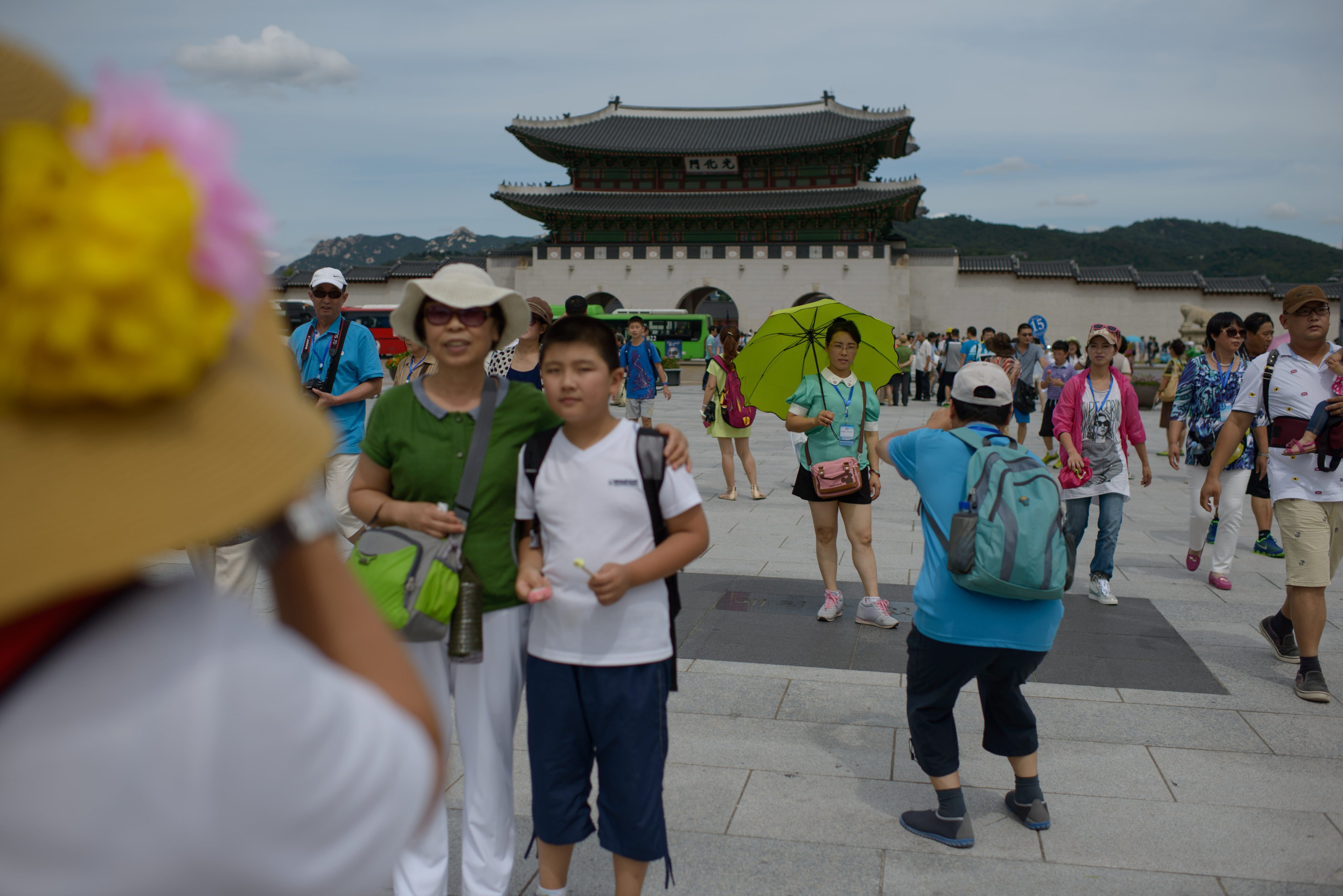 Tourists pose for photos at Gyeongbokgung Palace in Seoul in 2014. Photo: AFP