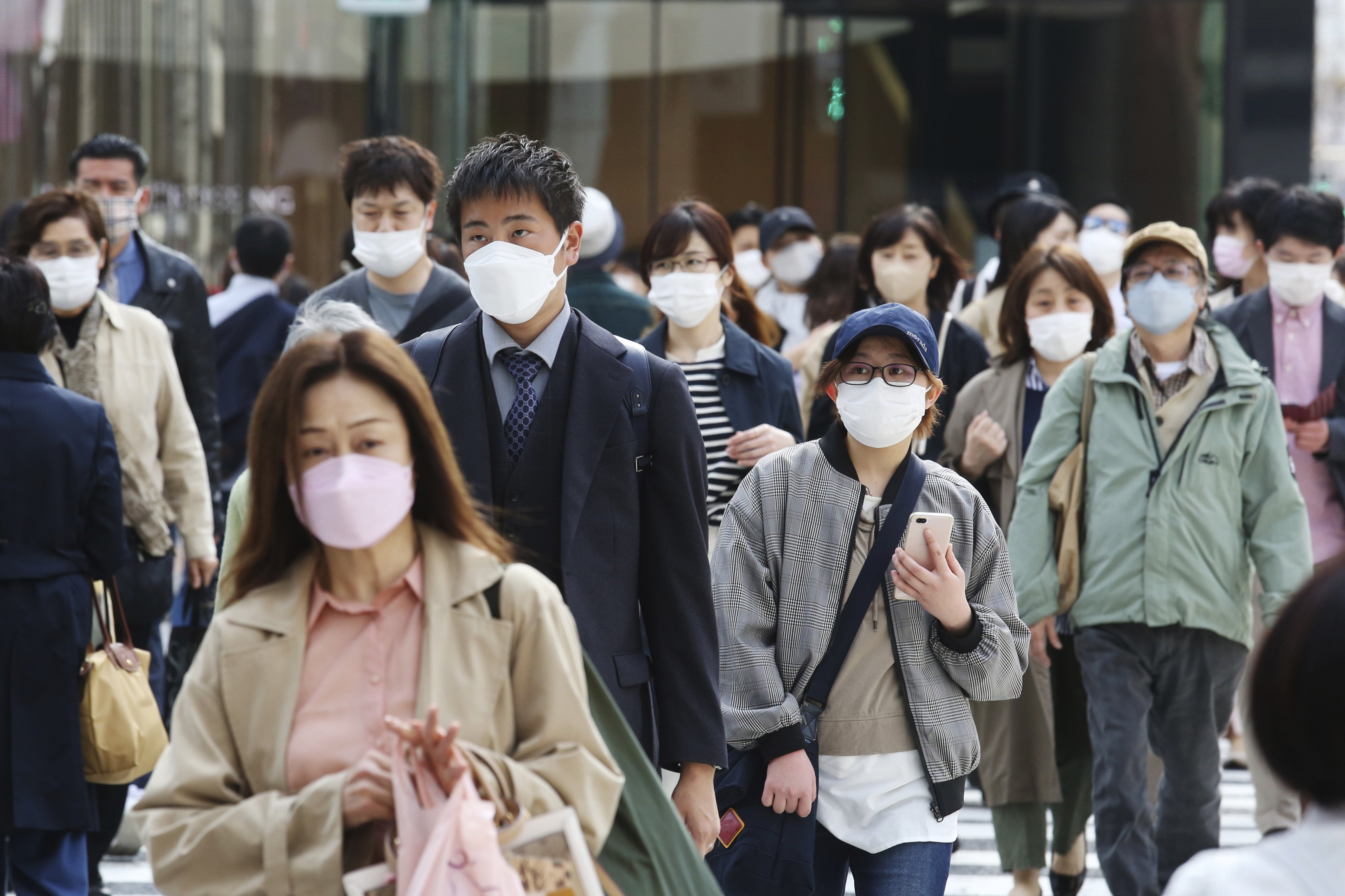 People wearing face masks in Tokyo. Photo: AP