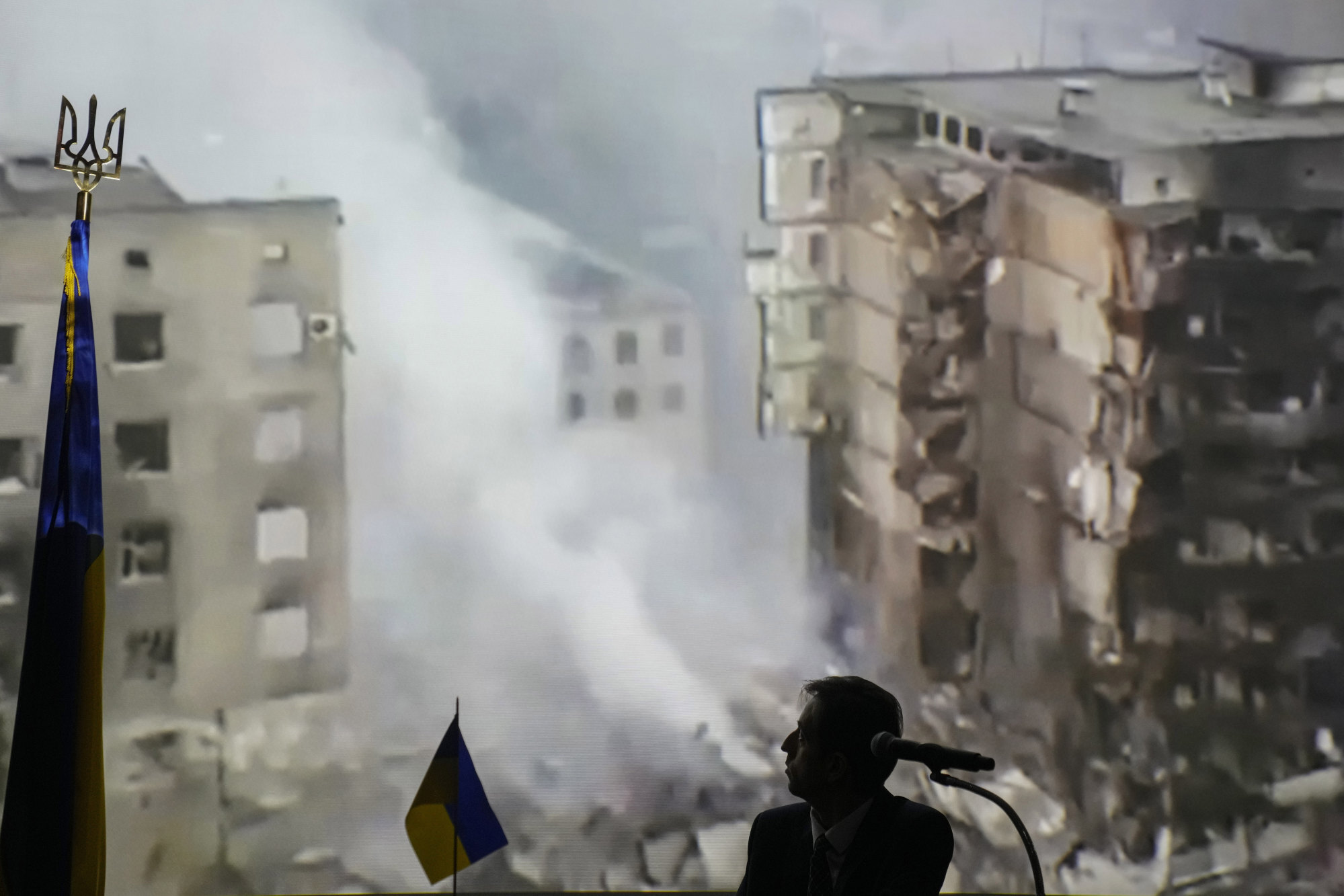 Oleksandr Lysak, Ukraine’s charge d’affaires in Thailand, presents a video during a press conference in Bangkok on Friday showing damage from a Russian air strike. Photo: AP