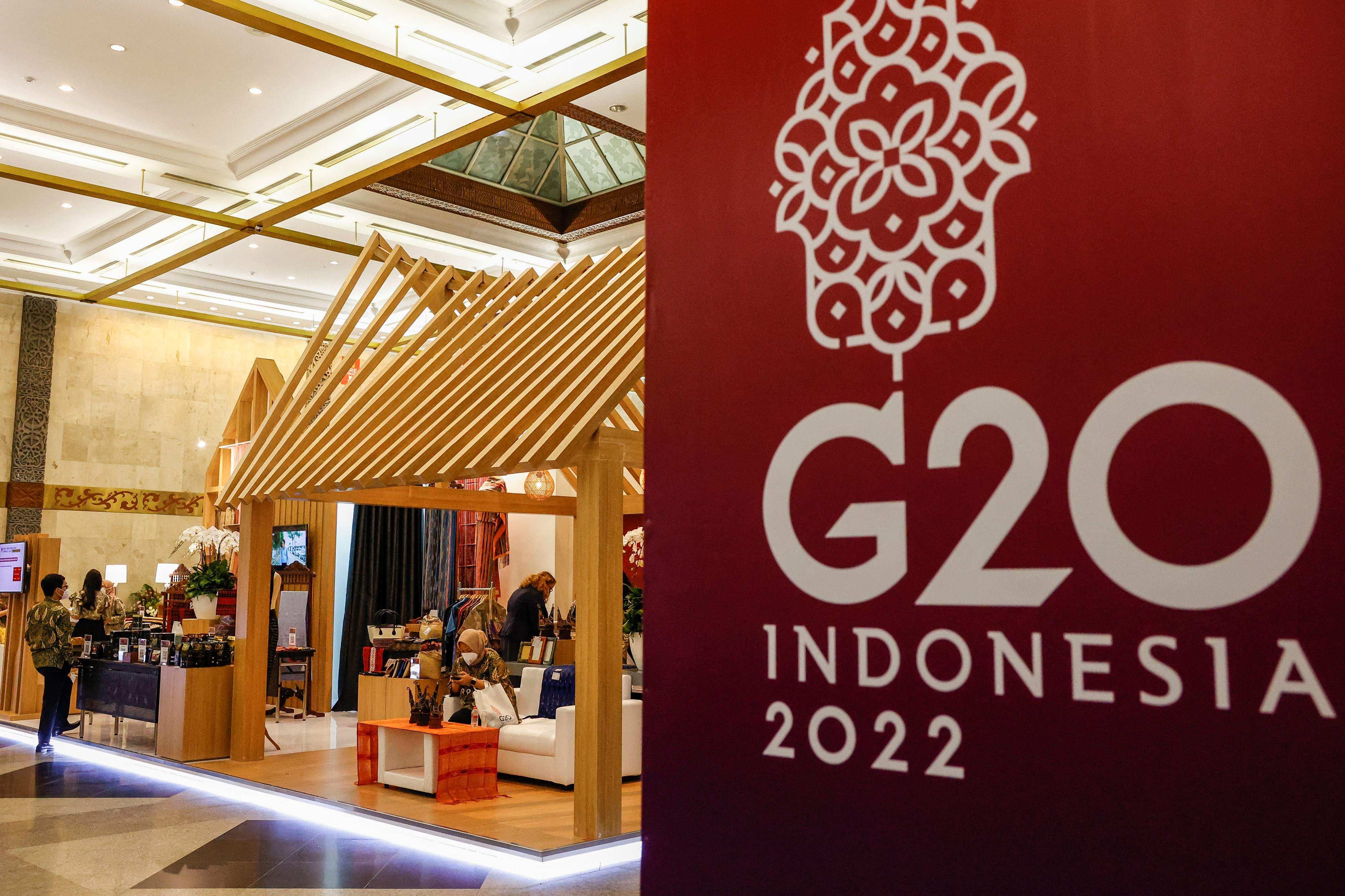Officials prepare exhibition stands at a venue for a G20 meeting in Jakarta. Photo: AFP