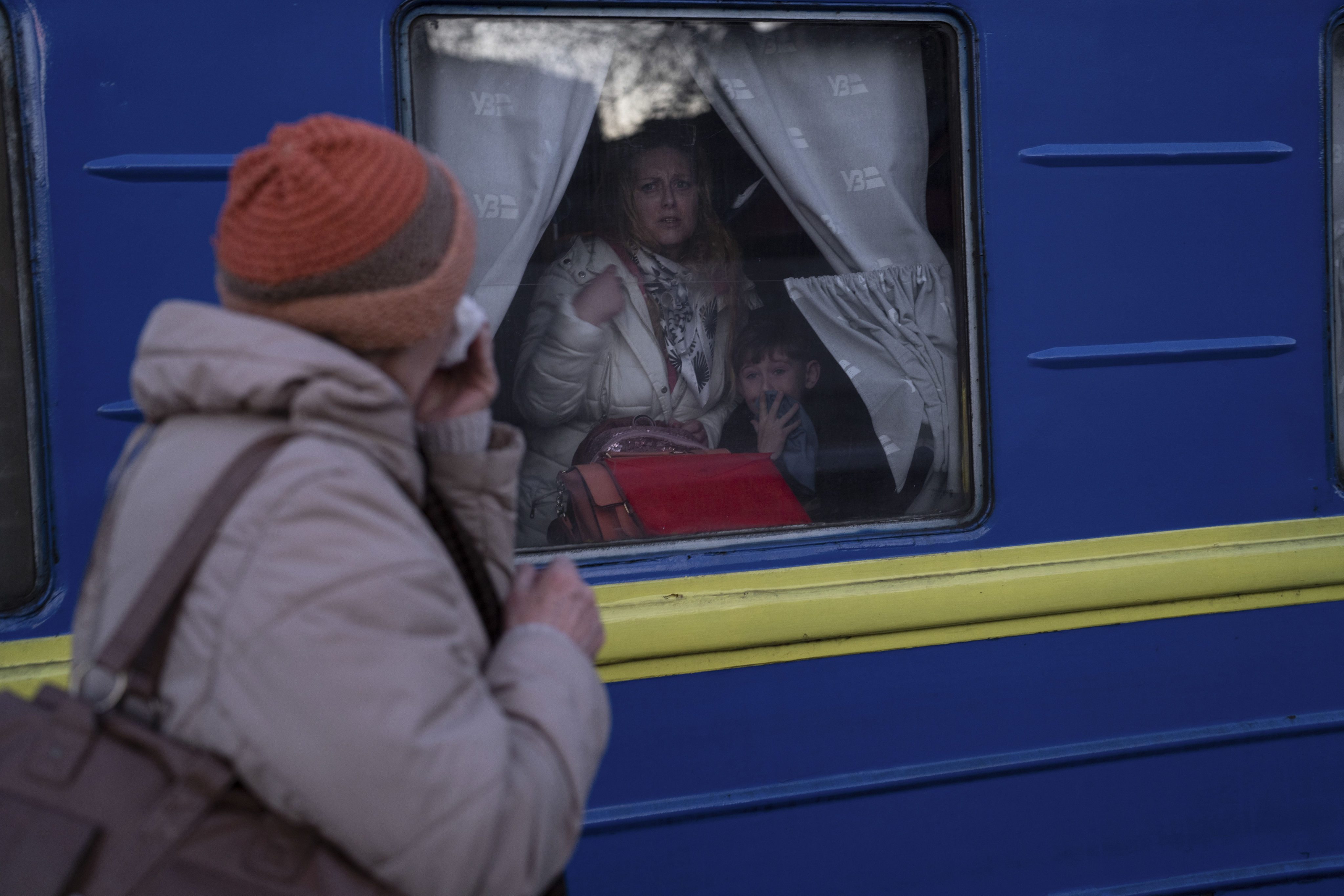 Ludmila (left) says goodbye to her granddaughter Kristina and great grandson Yaric as they leave the train station in Odesa, southern Ukraine, on March 22. The UN refugee agency says more than 3.5 million people have fled Ukraine since Russia began its invasion. Photo: AP