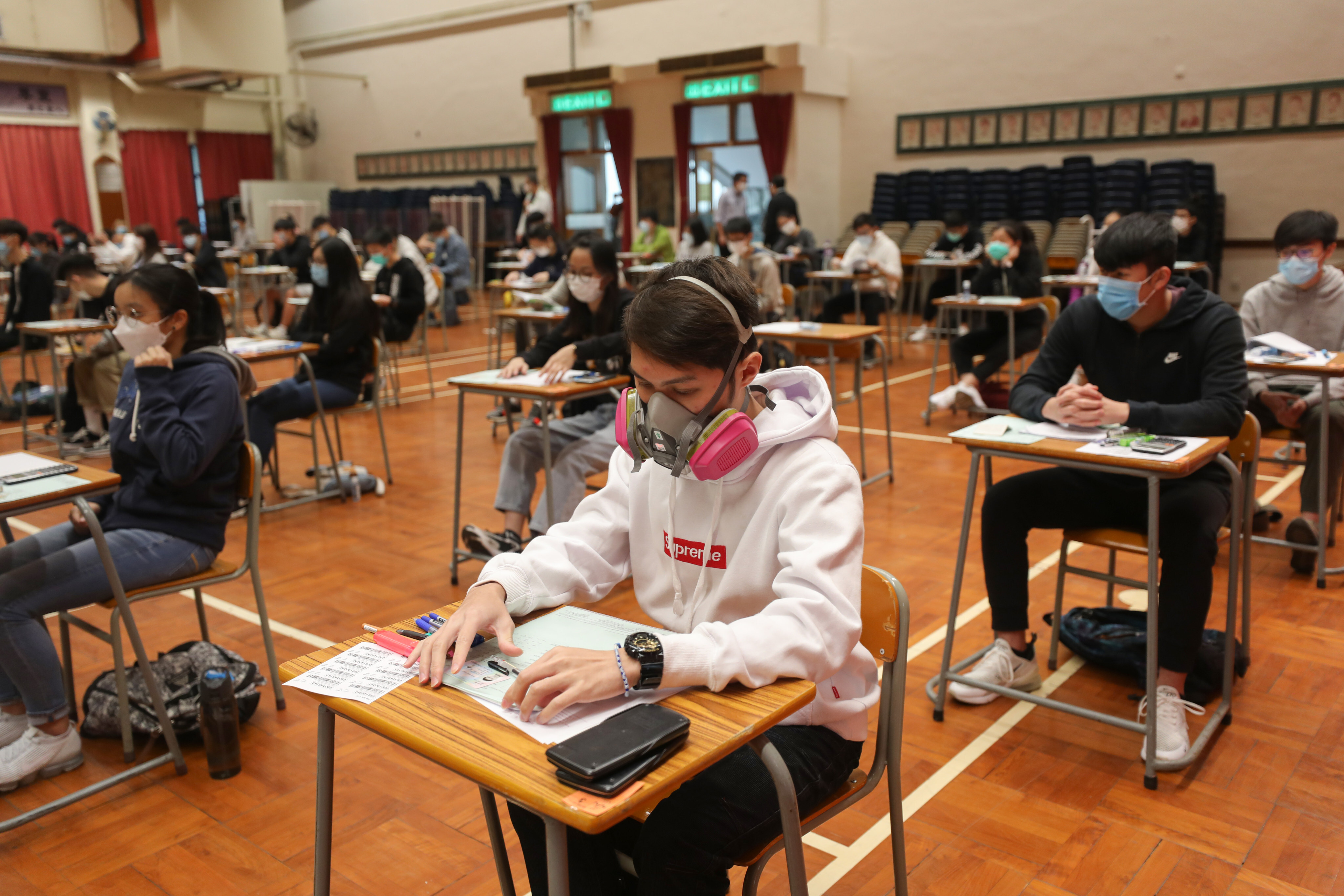 A government source says Hong Kong health authorities have suggested that teachers who have recovered from Covid-19 should supervise all DSE exams. Photo: Xiaomei Chen