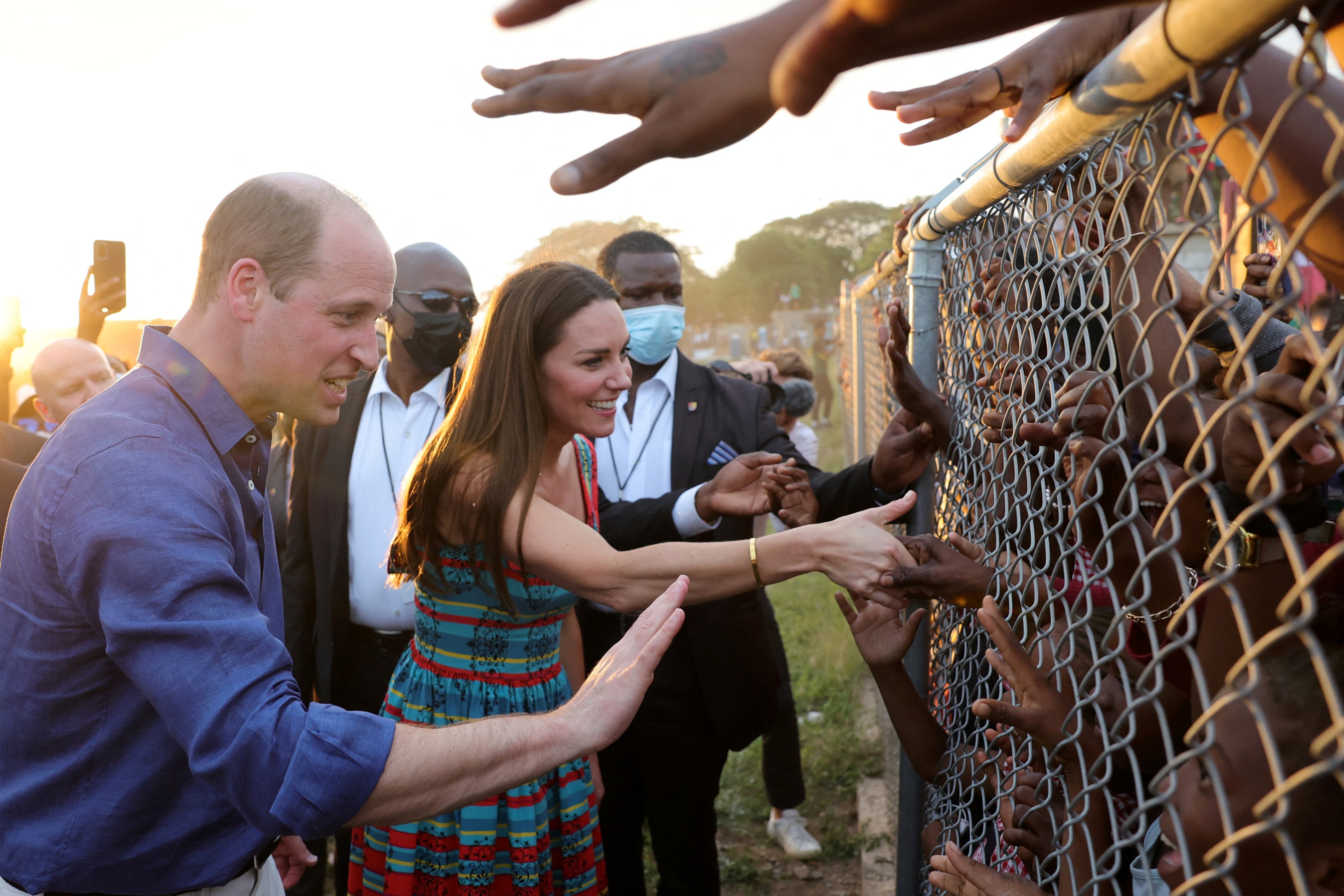 Prince William and Kate, Duchess of Cambridge shake hands with children during a visit to Trench Town in Kingston, Jamaica on Tuesday. Photo: Reuters