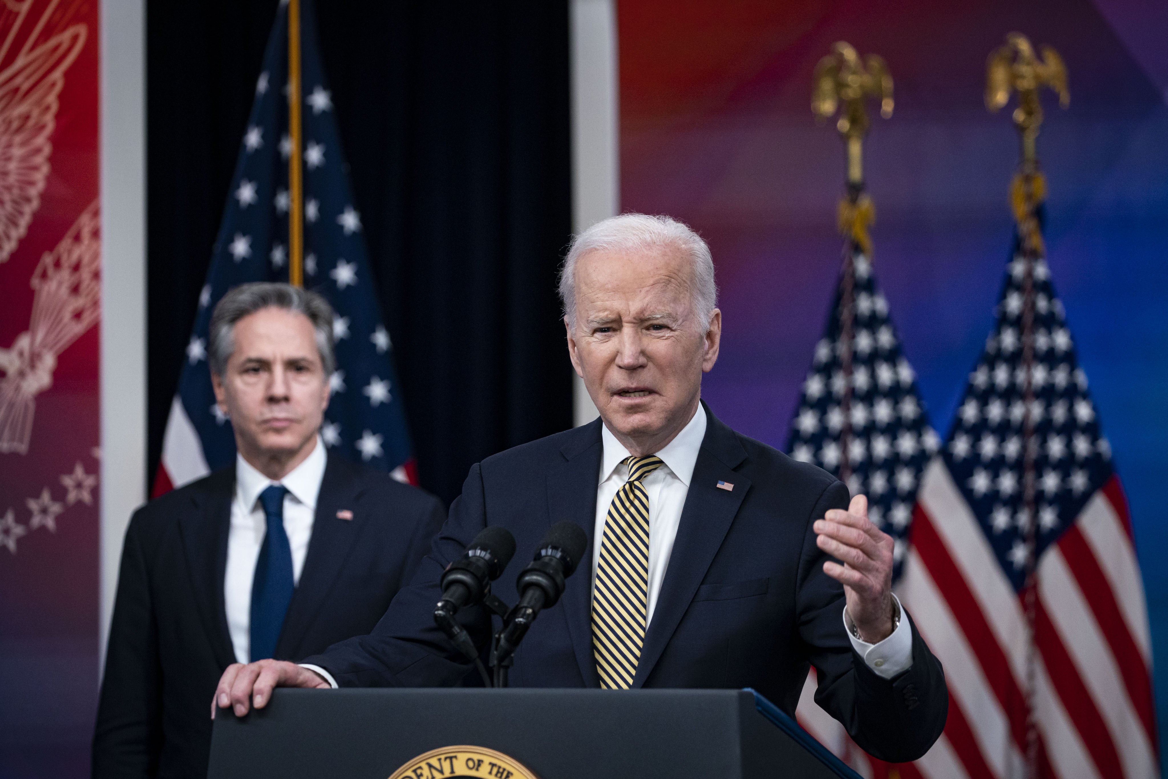 US President Joe Biden speaks as US Secretary of State Antony Blinken listens to Biden outlining America’s assistance to Ukraine. Photo: Bloomberg