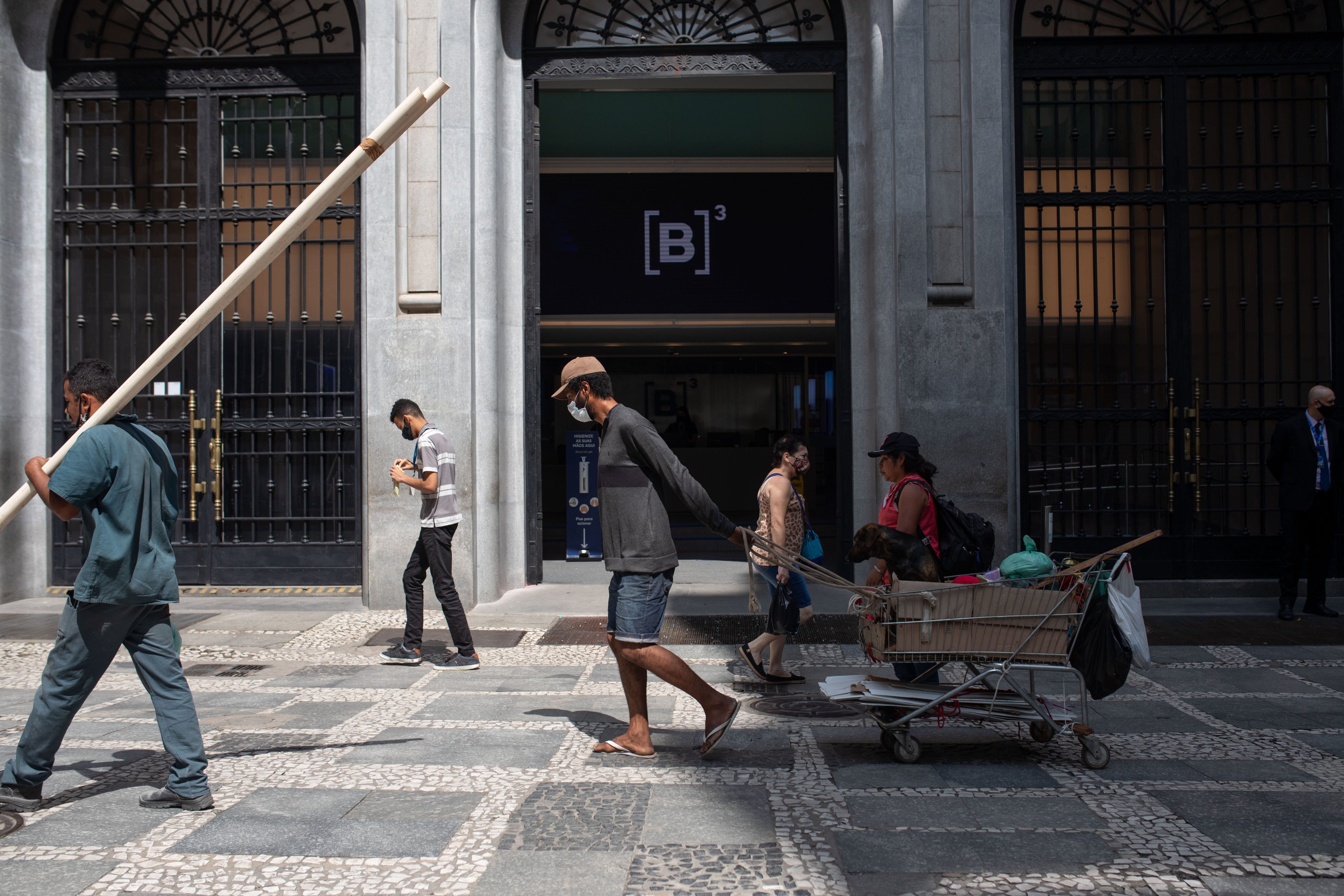 People walk past the Brasil Bolsa Balcao (B3) stock exchange in Sao Paulo, Brazil, on February 24. The Brazilian real has performed well over the past year as investors are drawn by low prices and high yields. Photo: Bloomberg