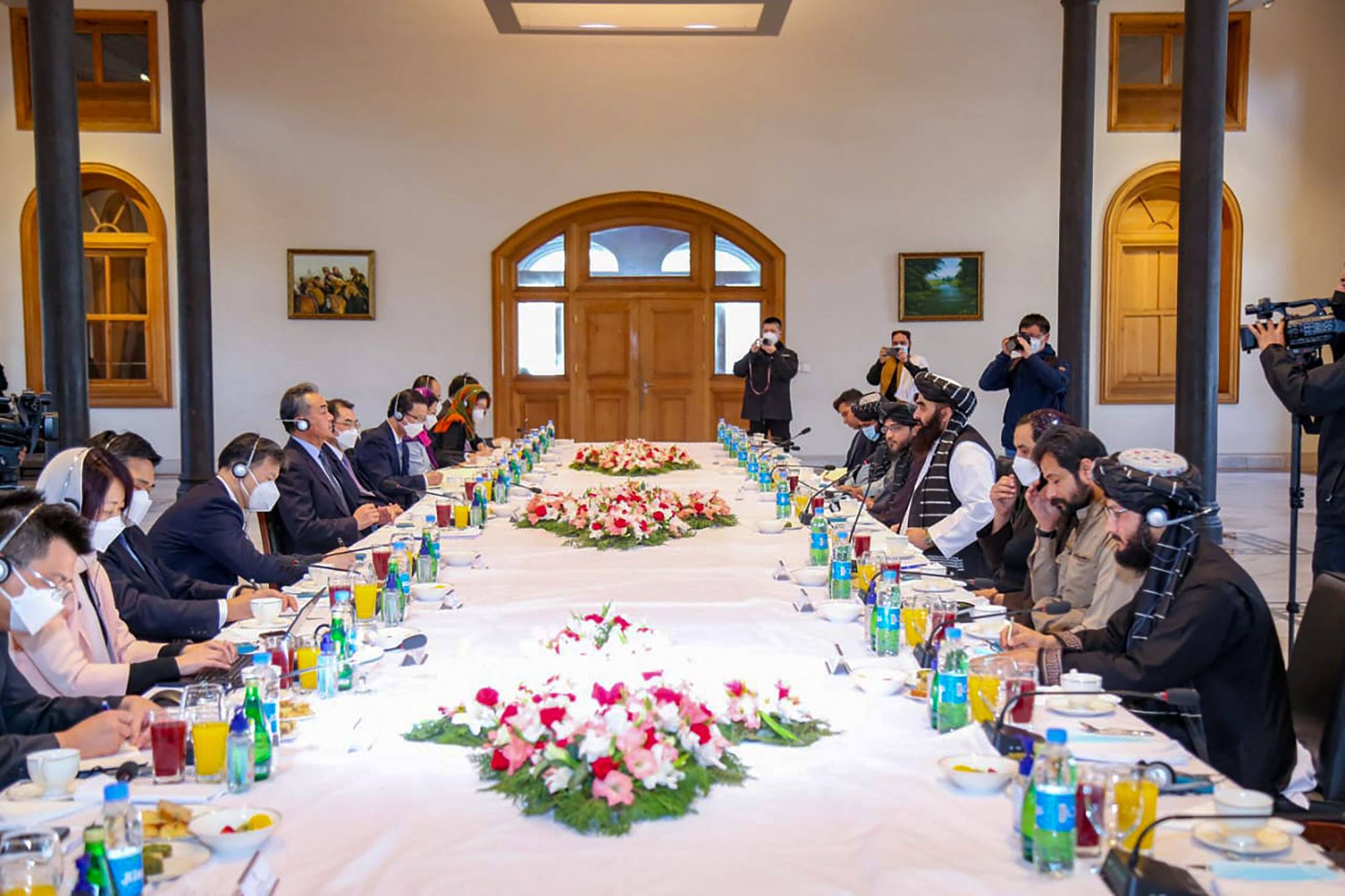 Taliban acting foreign minister Amir Khan Muttaqi (centre right) meets China’s Foreign Minister Wang Yi (centre left) in Kabul on Thursday. Photo: AFP