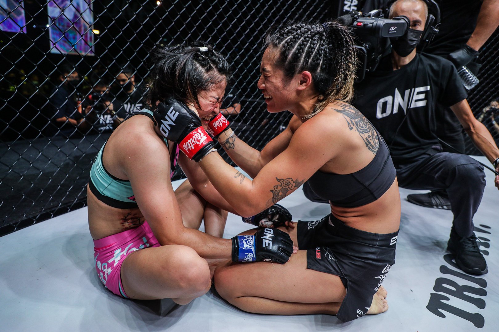 Angela Lee (right) comforts Stamp Fairtex after their fight at ONE X. Photo: ONE Championship.