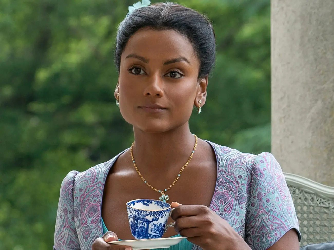 Kate Sharma, played by British-Indian actress Simone Ashley, holds a cup of tea in Netflix period drama Bridgerton. Photo: Liam Daniel/Netflix