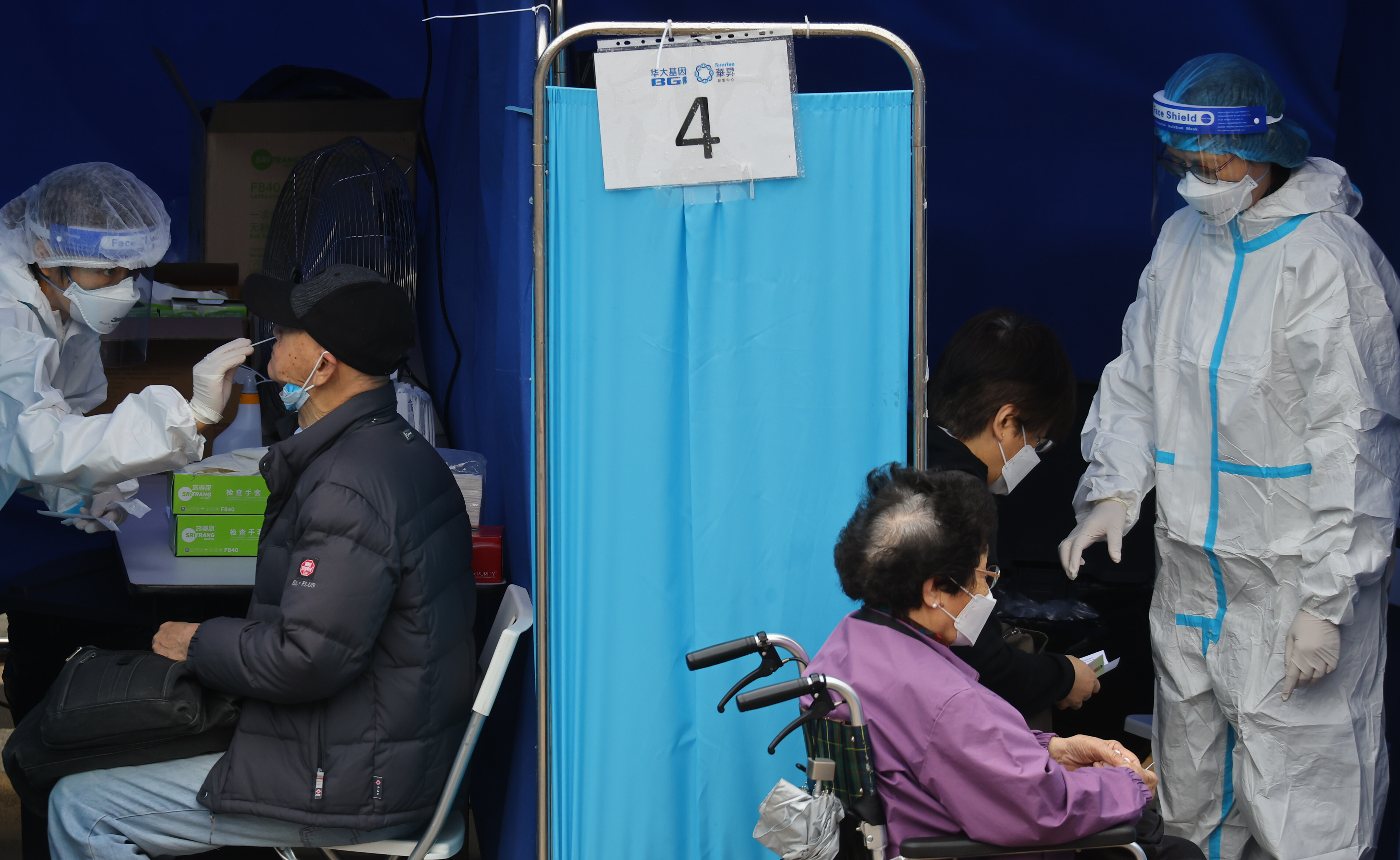 Residents are screened for Covid-19 at a mobile testing centre in Sha Tin. Photo: Dickson Lee