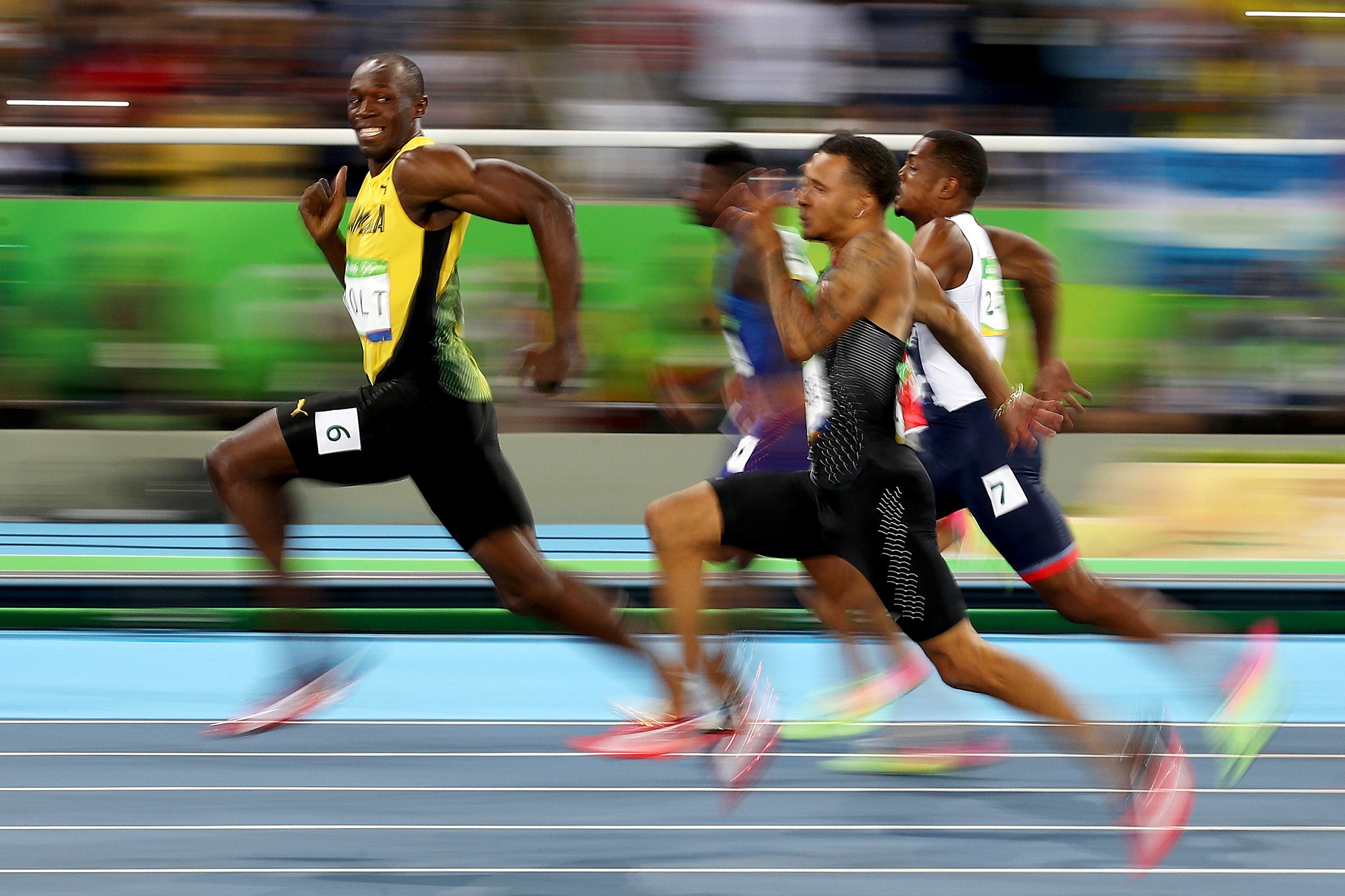 A smiling Usain Bolt competes in the men’s 100m semi-final at the Rio Olympics. Photo: Getty Images