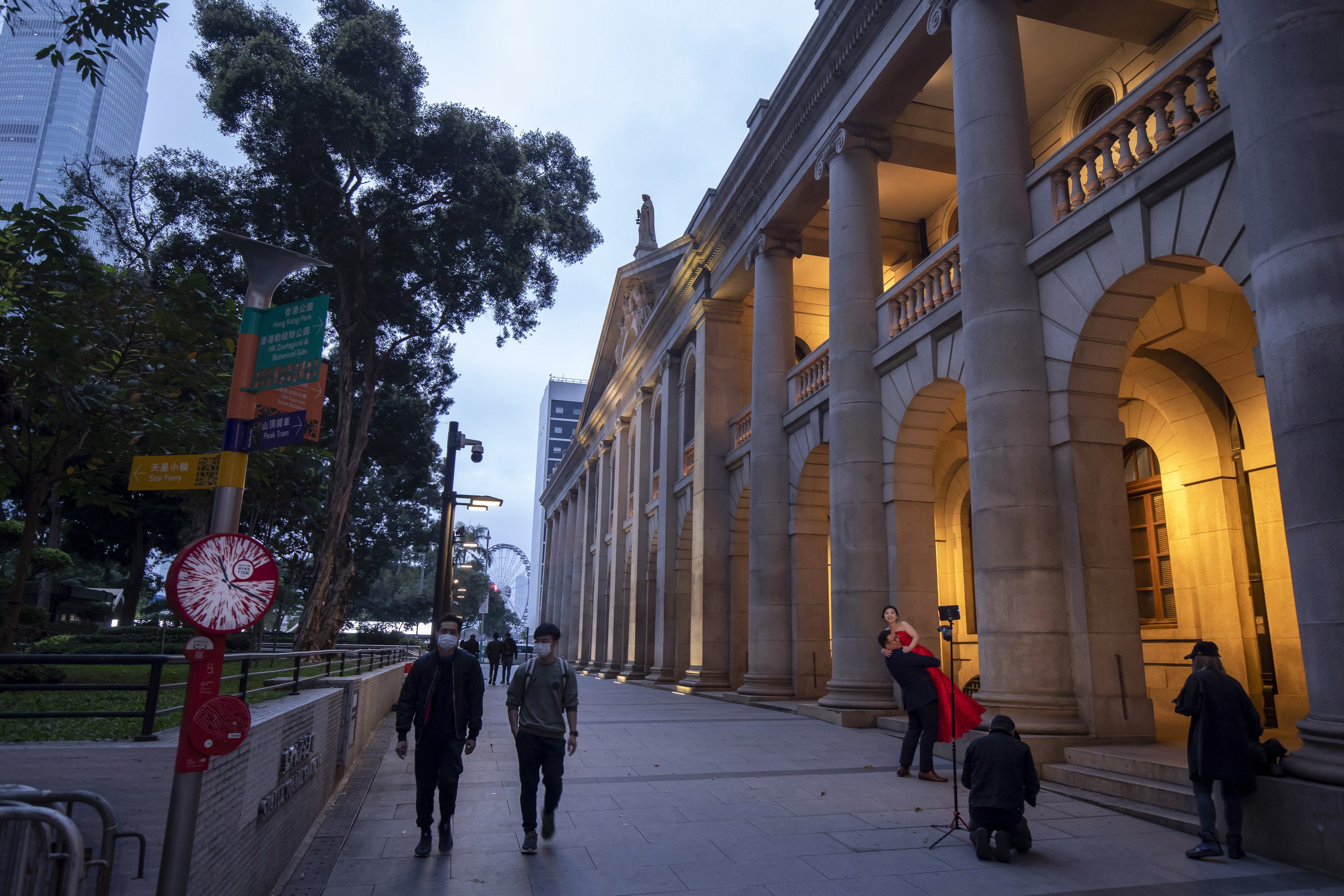 A couple pose for photographs outside the Final Court of Appeal after a ceremony to mark the opening of the legal year in Hong Kong on January 24. Photo: Bloomberg