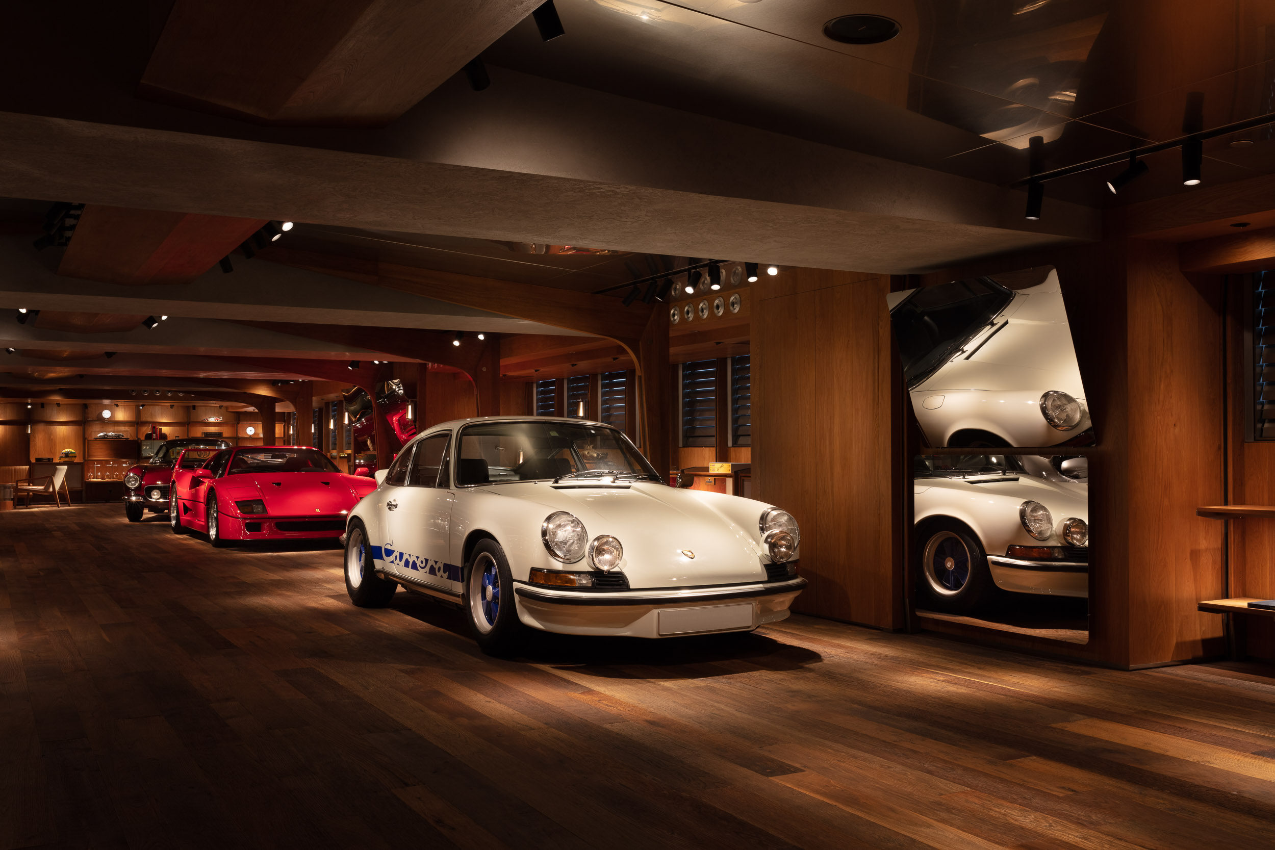 A vintage car collector’s “library” of motors and car memorabilia in Hong Kong marries function and form in a space that would not look out of place in a James Bond movie. Photo: A Work of Substance