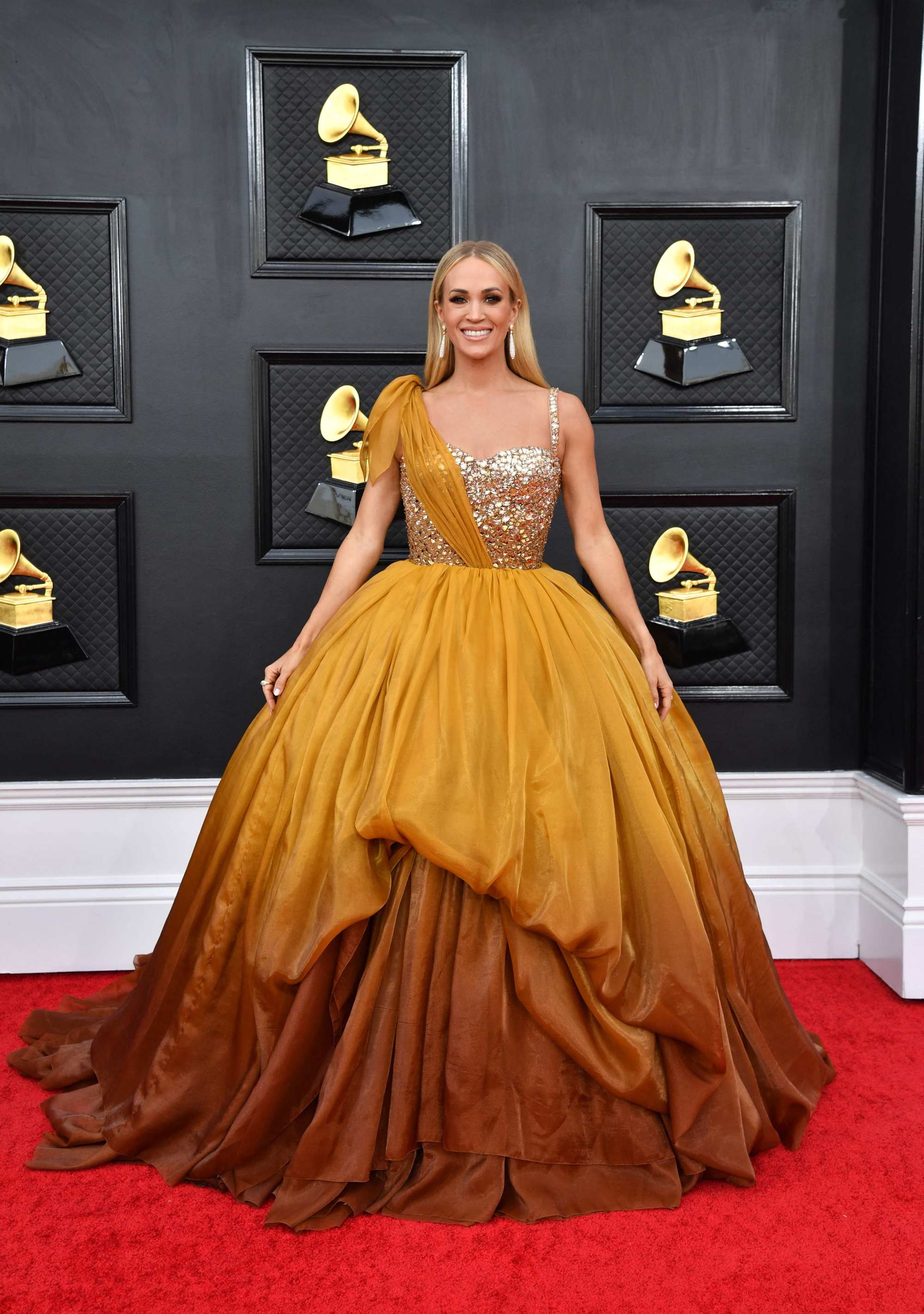 US singer/songwriter Carrie Underwood’s look was more beauty pageant than red carpet ready. Photo: AFP