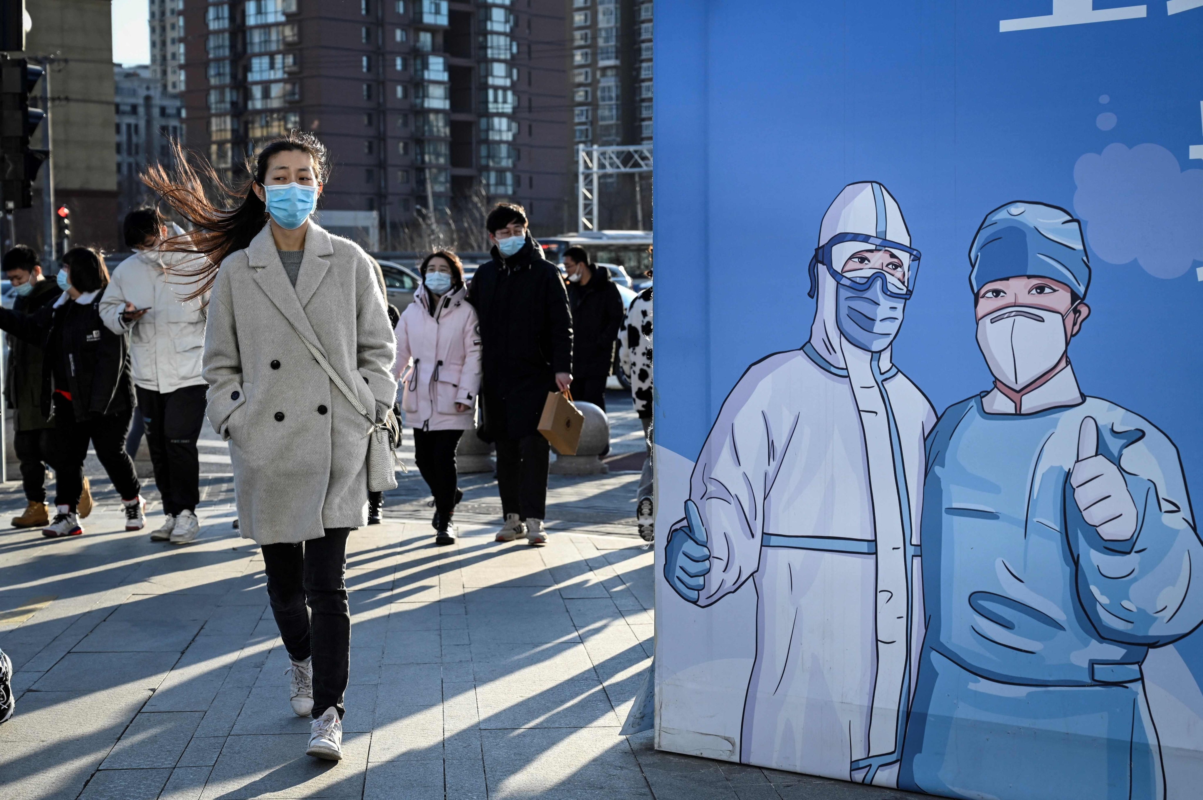 A billboard promoting vaccinations outside a shopping mall in Beijing. Photo: AFP