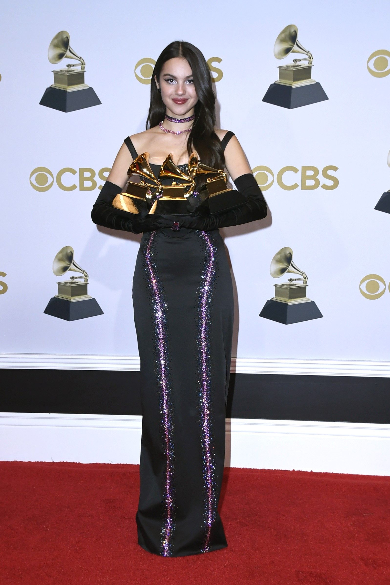 Olivia Rodrigo, winner of Best New Artist and Best Pop Solo Performance for Drivers License, clutches her new awards. Photo: AFP