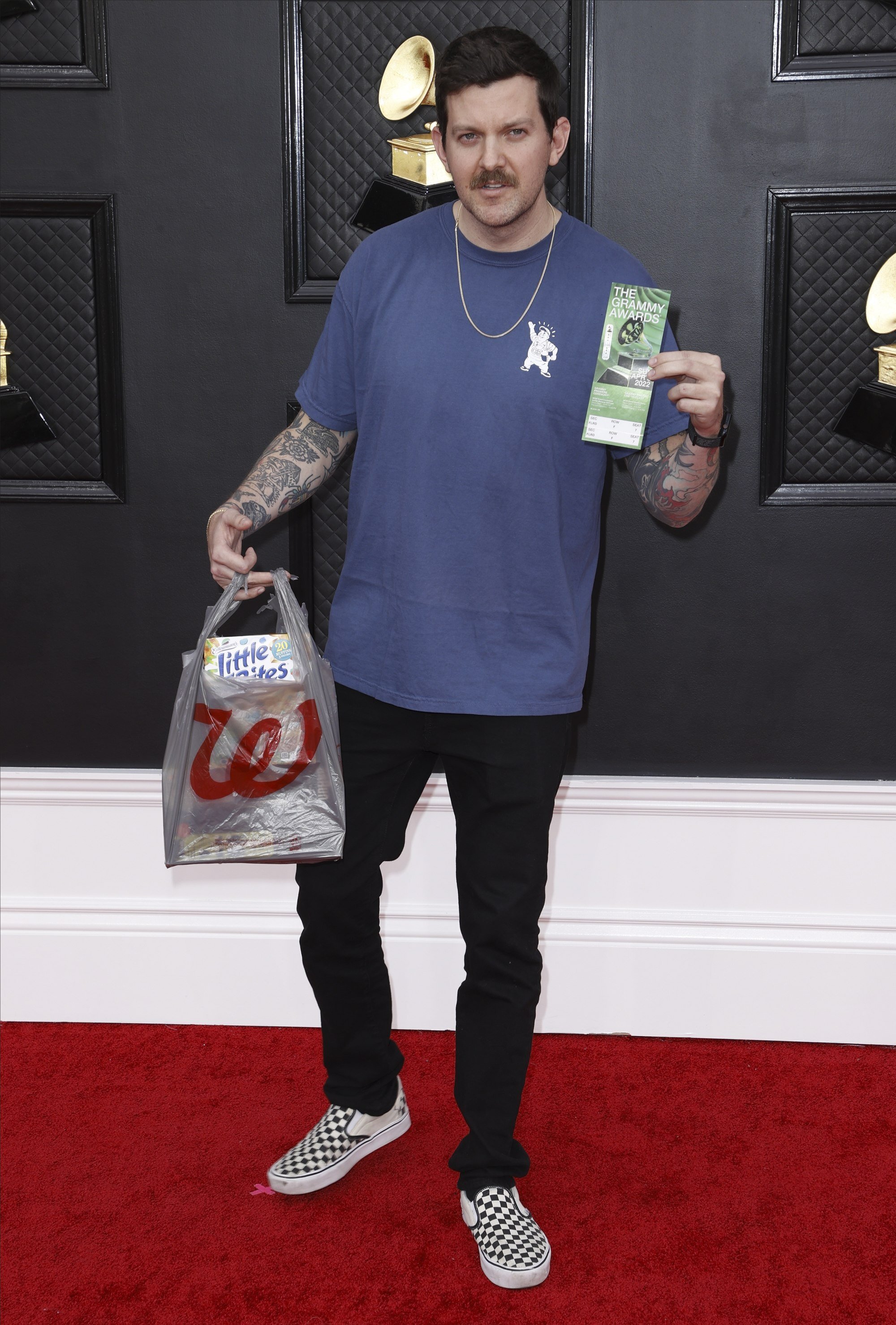 Dillon Francis arrived at the Grammy Awards with a bag of snacks from Walgreens. Each to their own. Photo: EPA-EFE