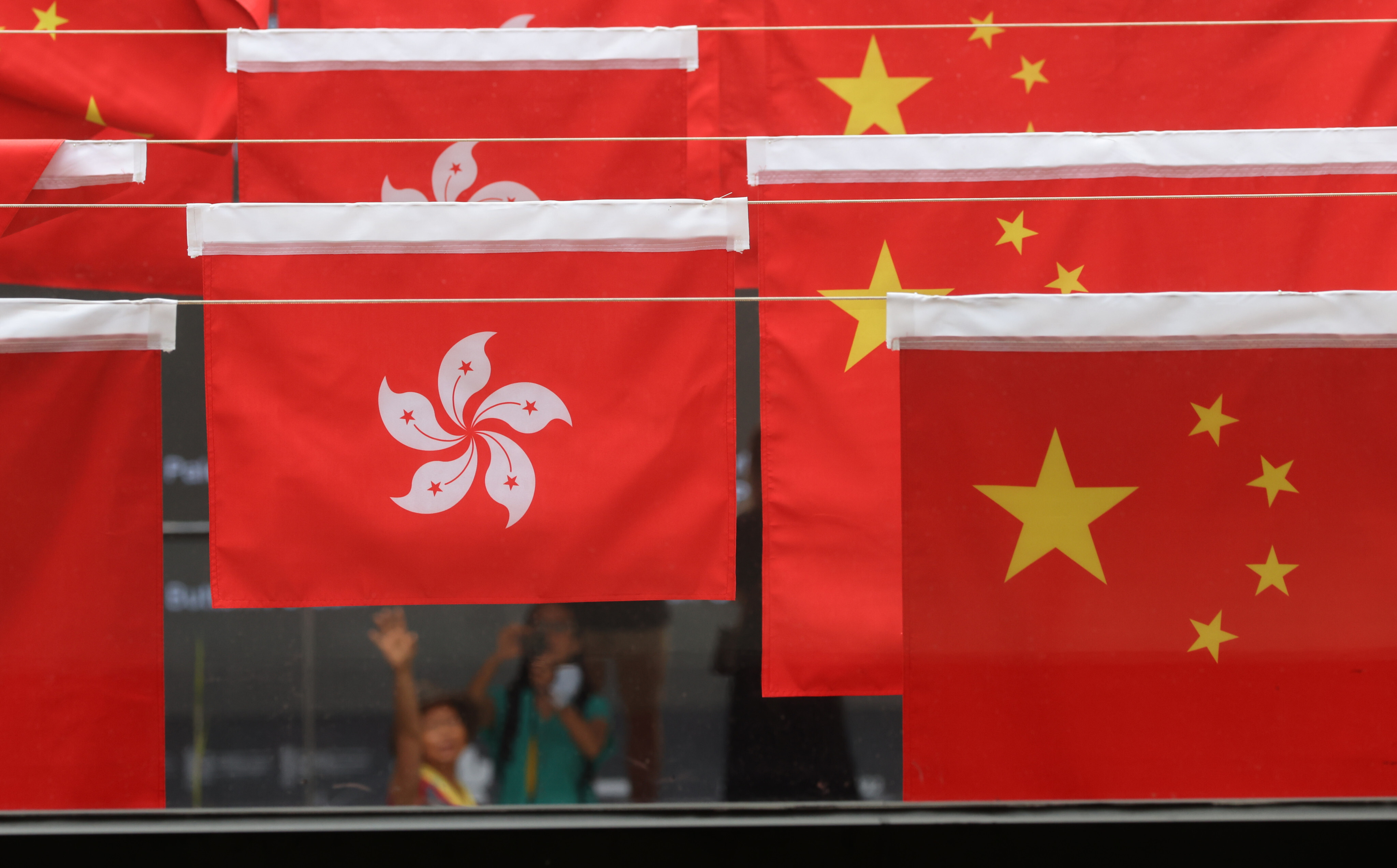 Hong Kong and Chinese flags fly in Central Market for National Day, on September 30, 2021. Chinese leaders are committed to upholding “one country, two systems”. Photo: Dickson Lee