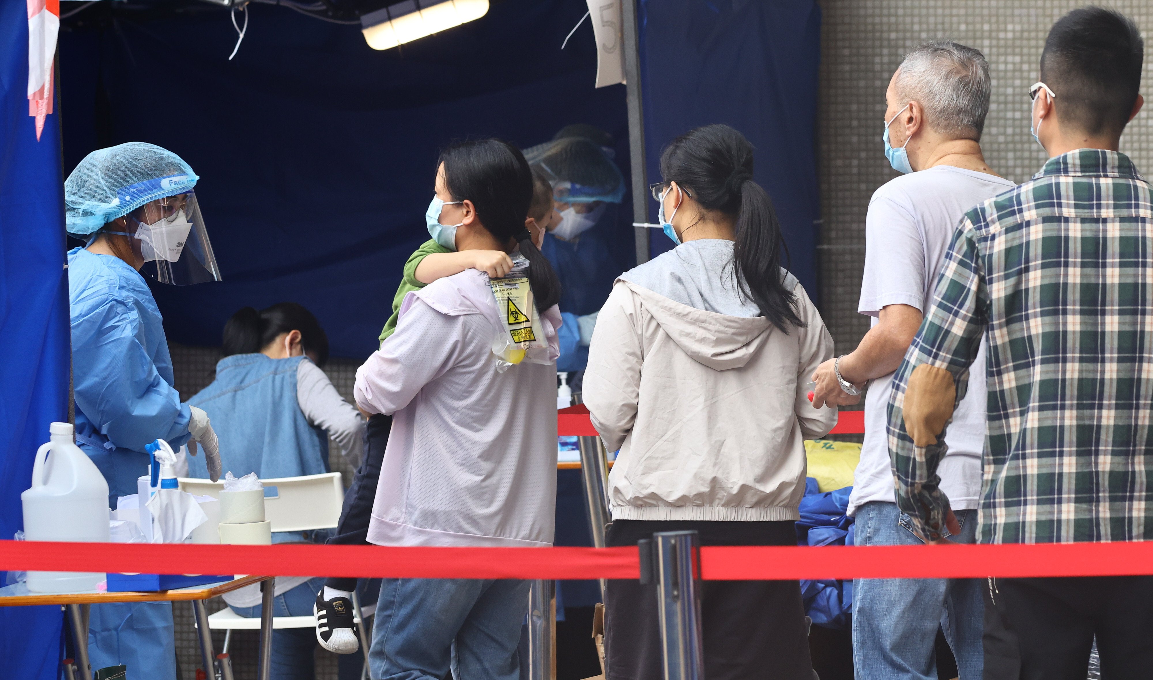 Residents undergo mandatory testing at a housing estate under lockdown in Hong Kong. Photo: Dickson Lee